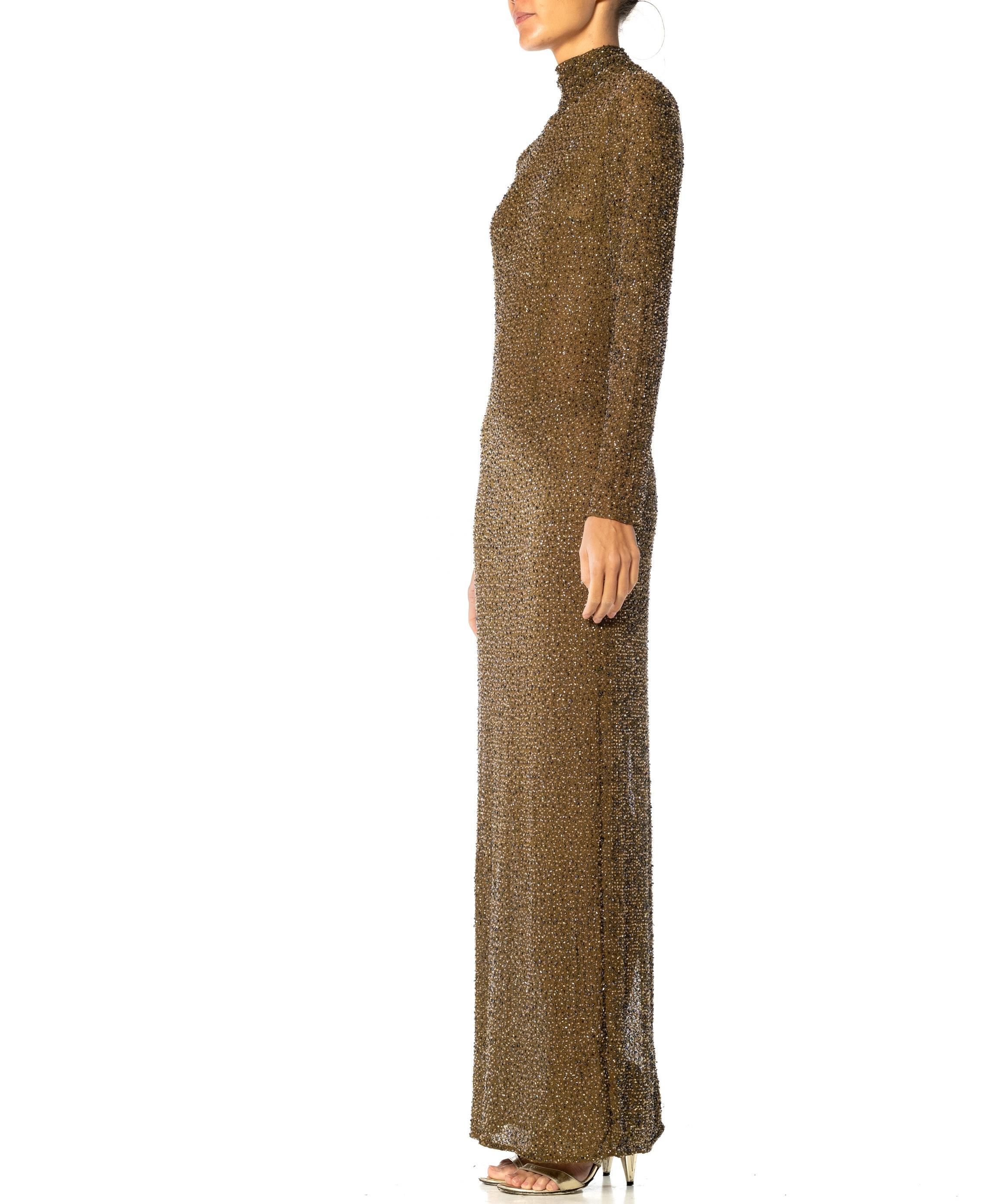This body hugging gown has a lot of stretch and is perfect for showing off all your curves whilst retaining a skin covered mystique. 1990S Olive Green Rayon & Elastane Mesh Stretch Long Sleeve Beaded Gown 