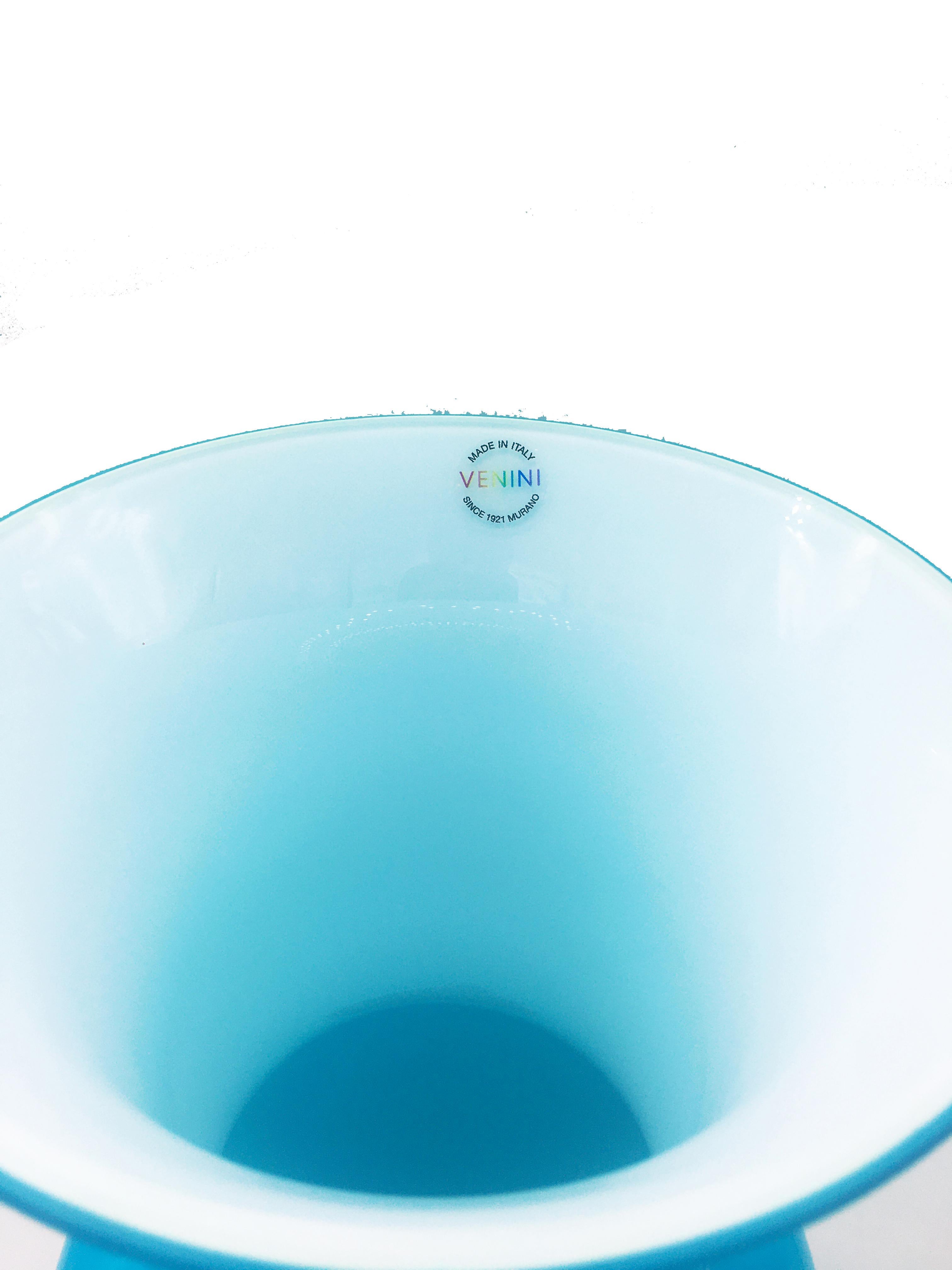 Venini glass vase with slim, oval shaped body and funnel shaped neck. Featured in aquamarine colored glass.
