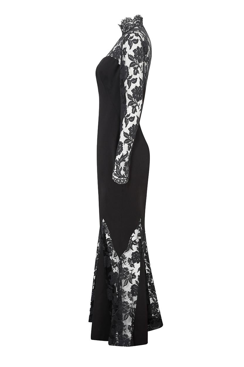 This sensational 1990s or early 2000's black silk crepe and lace evening gown is from Parisian house Azzaro Boutique and is an archive piece of the founder designer Loris Azzaro's iconic 1970s designs. Azzaro was popular with actresses such as