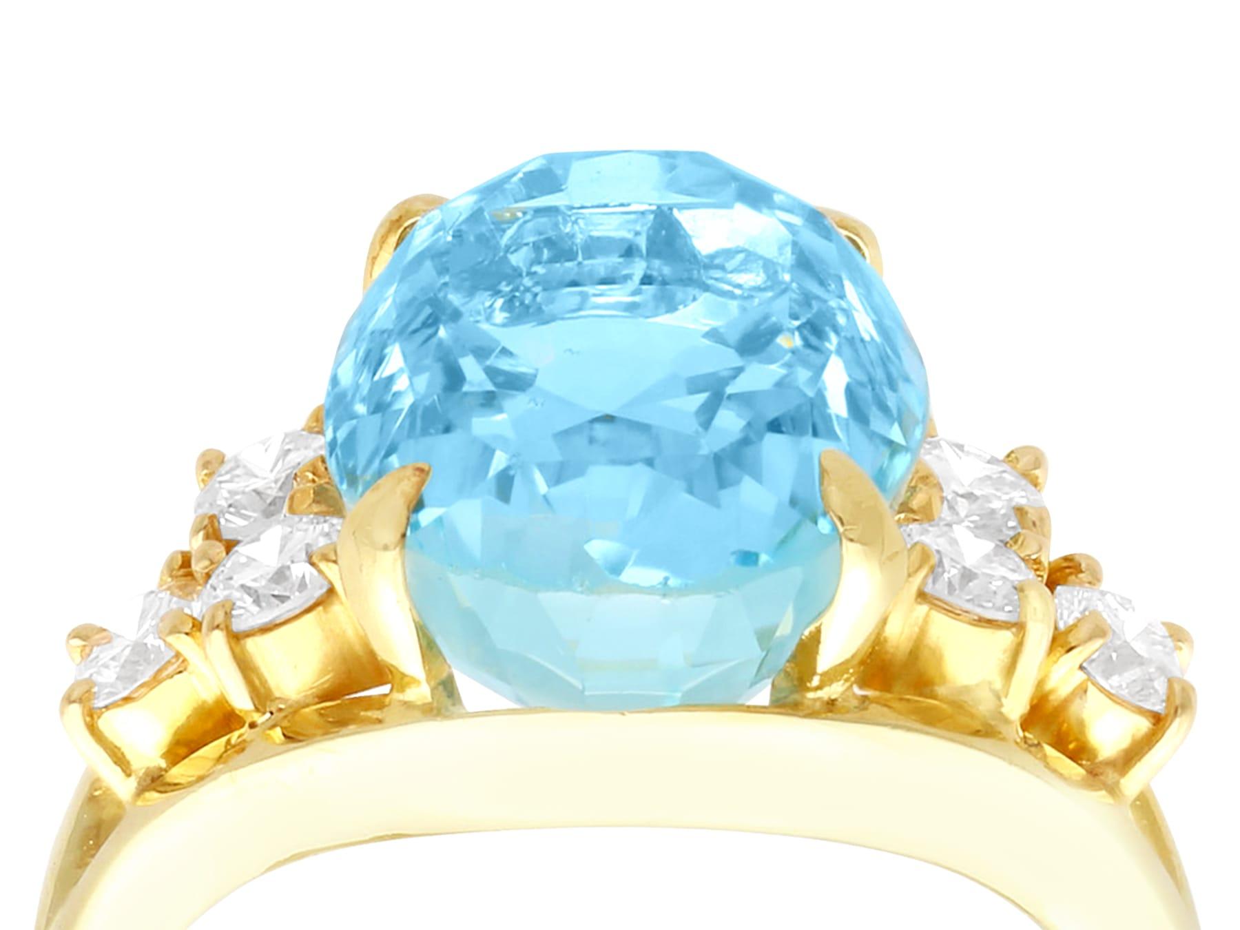 A fine and impressive vintage 6.15 carat oval cut aquamarine and 0.42 carat diamond, 14 karat yellow gold cocktail ring; part of our diverse vintage jewelry and collections.

This fine and impressive vintage oval cut aquamarine ring has been crafted