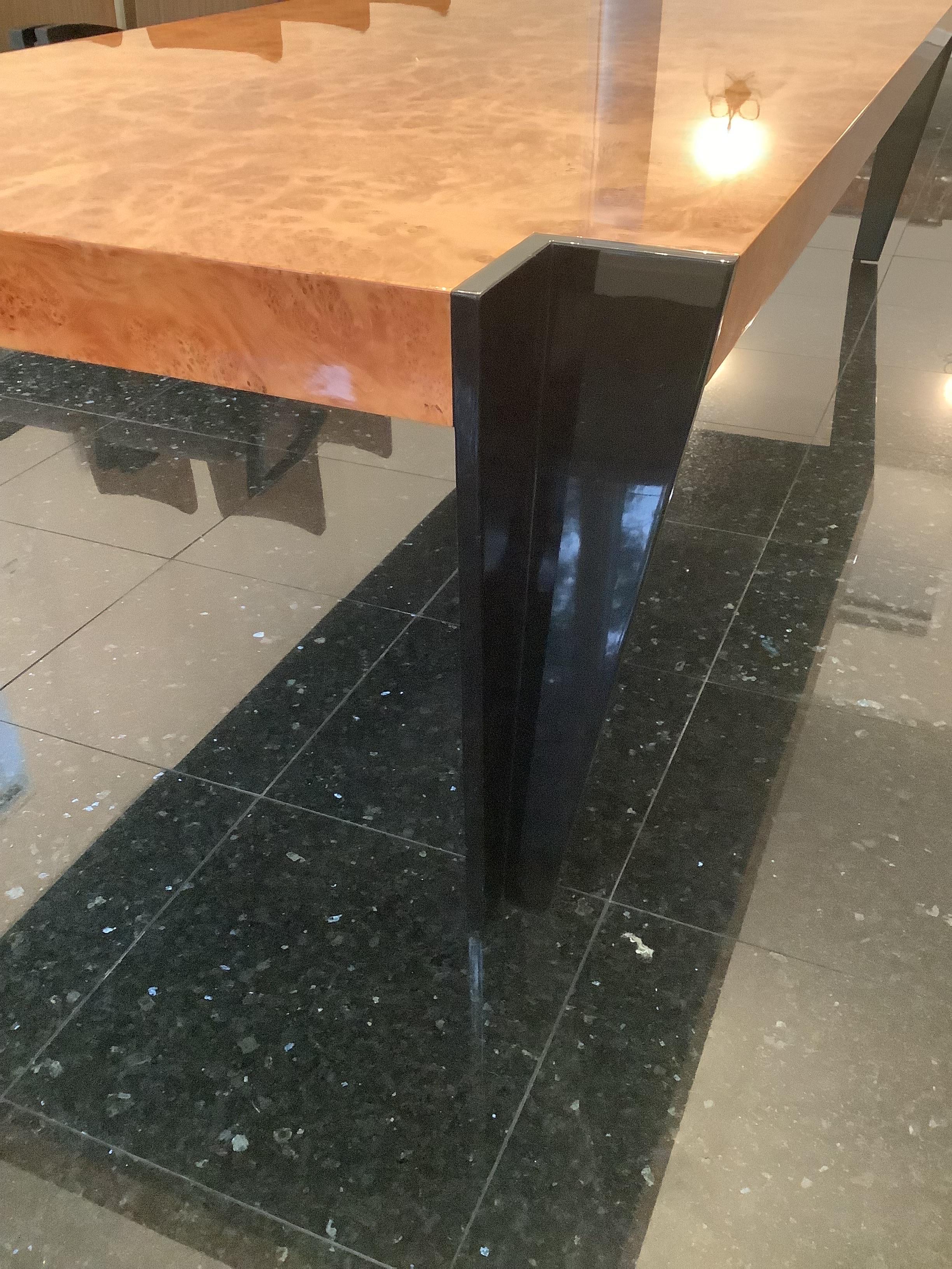High gloss Burlwood from the Pace Collection. Lacquered Black notched legs, ultra modern concept with an art deco flare. Solid thick Burlwood table-top in one seamless slab. Great for any space that has modern minimalist decoration and furnishings.