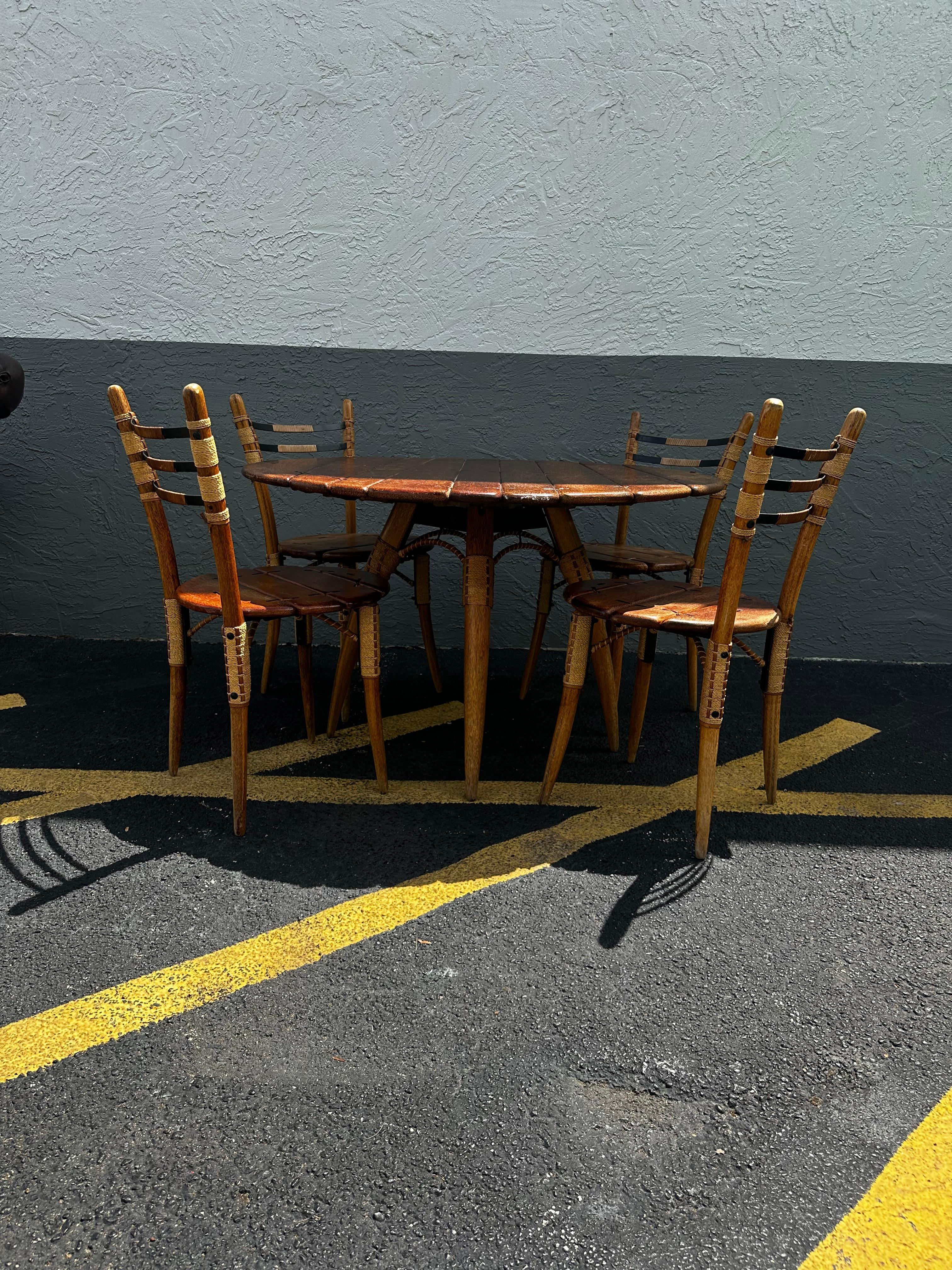 This sought after dining set from Pacific Green Furniture Co. in Fiji is handcrafted and hand finished using 100 year old palm trees that have exceeded their fruit production years. The resulting palmwood is as durable as it is beautiful and yet