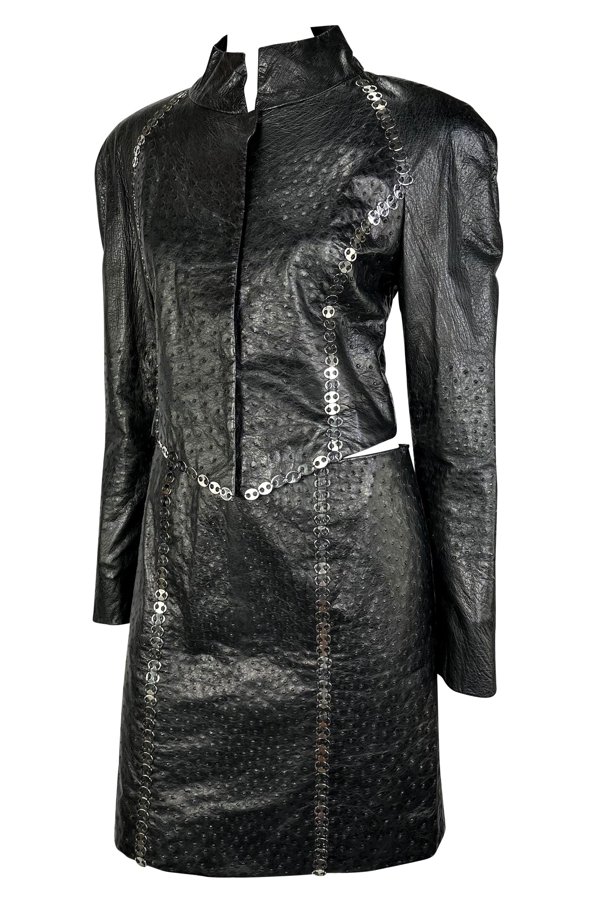 Presenting an incredible black ostrich leather Paco Rabanne Haute Couture skirt set. From the early 1990s, this stunning custom set is constructed entirely of black ostrich leather and is accented with silver Paco Rabanne silver-tone metal accents.