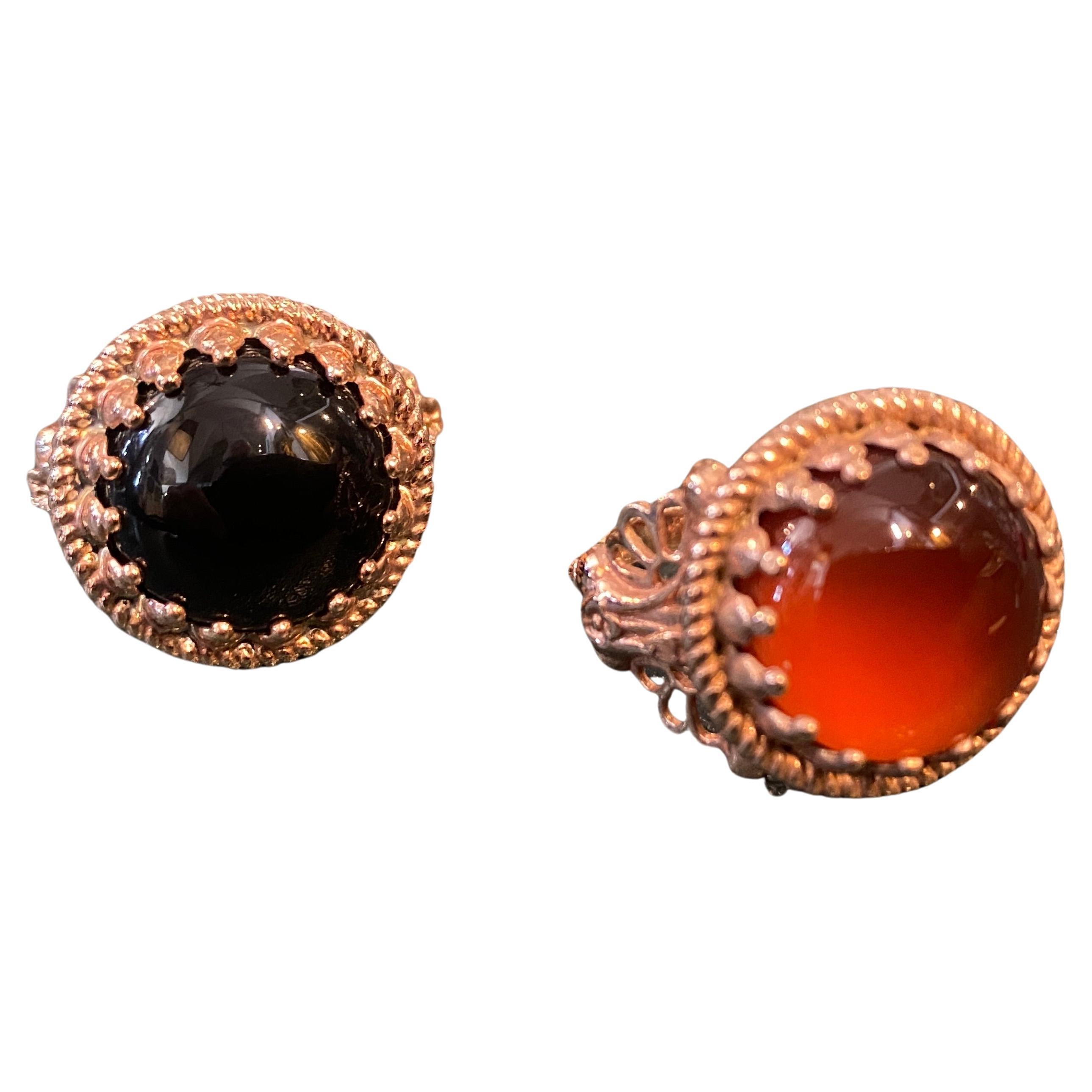 Two cocktail rings designed and manufactured in Italy by Anomis, they are in Bronze, one with Onyx  round cabochon, the other one it's with a round carnelian. they arenunique pieces of jewelry that showcase the natural beauty of onyx and carnelian