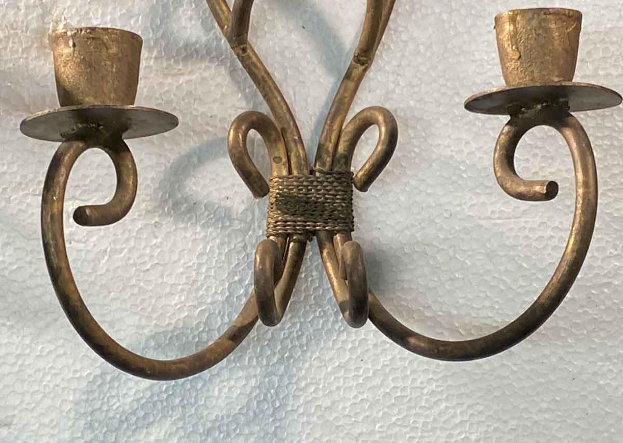 1990s wrought iron candle sconces with a light gold finish. These are not electrified and are meant for wax candles. This can be seen at our 400 Gilligan St location in Scranton, PA.