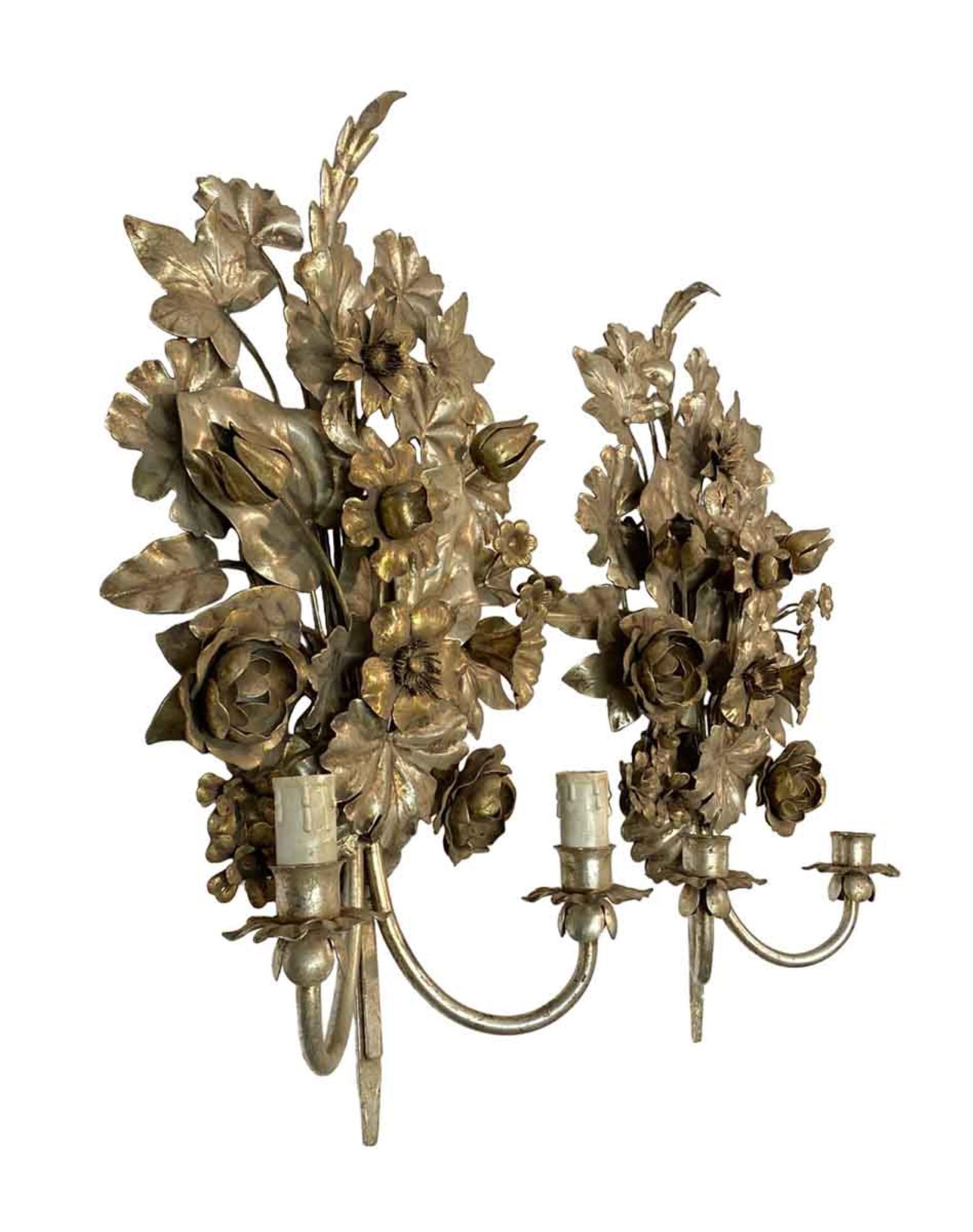 1990s pair handcrafted in Italy Hollywood Regency silver gilt sconces. The detail on these sconces is so refined that they look like actual flower bouquets. This can be viewed at our Scranton, Pennsylvania location. Please inquire for the exact