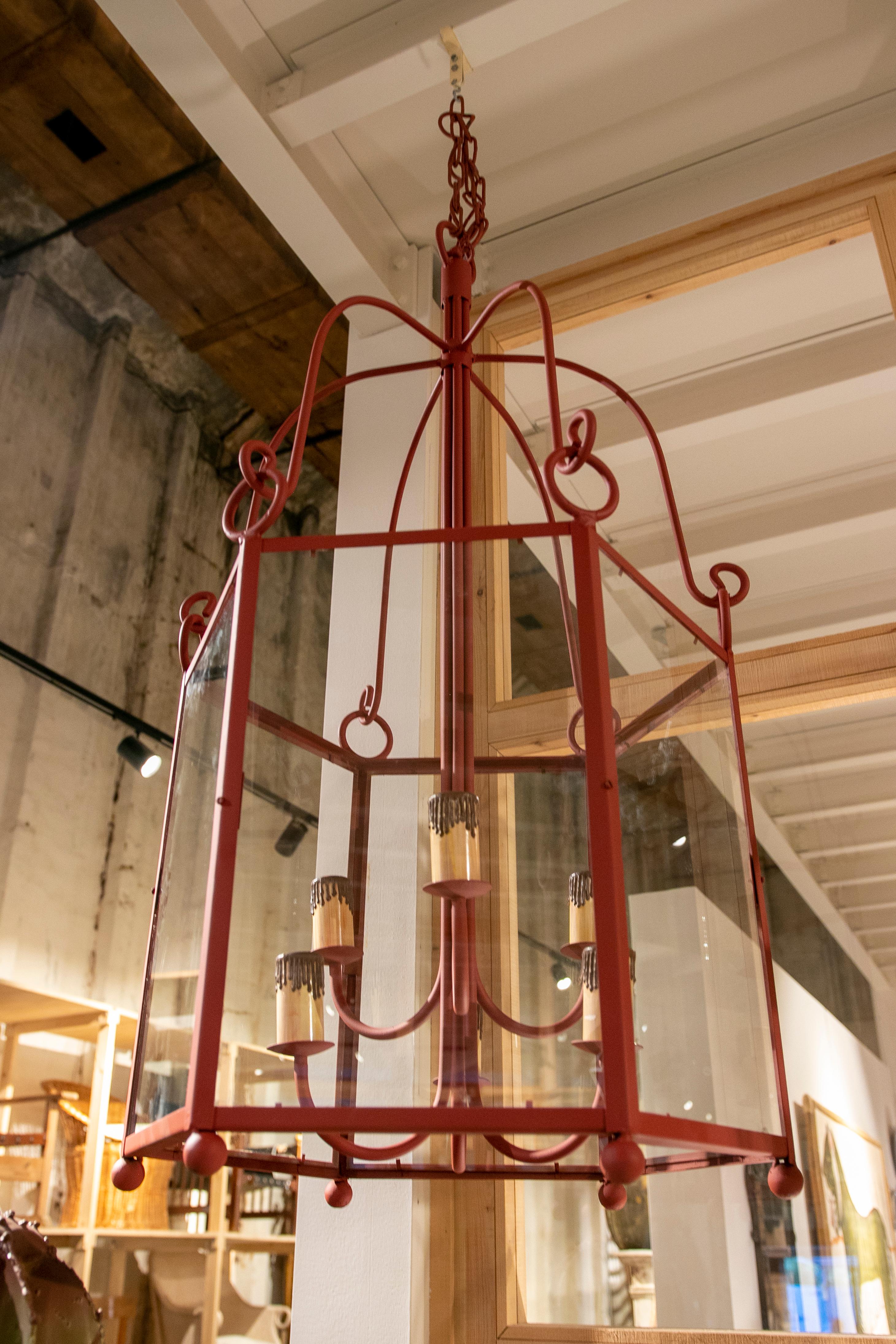 1990s Pair of painted in red iron lanterns with glass.