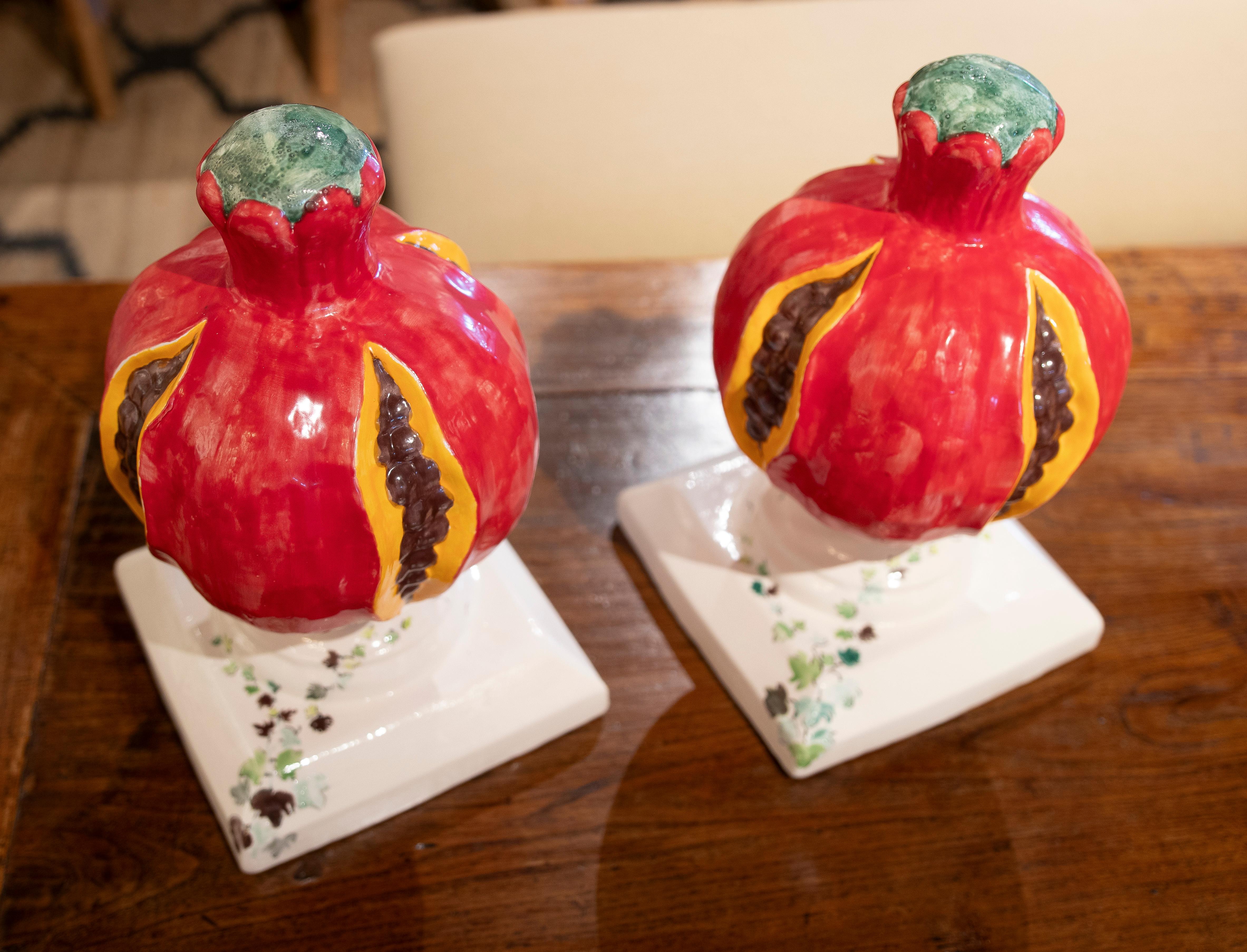 Spanish 1990s Pair of Pomegranate-Shaped Ceramic Sculptures on a Painted Base For Sale