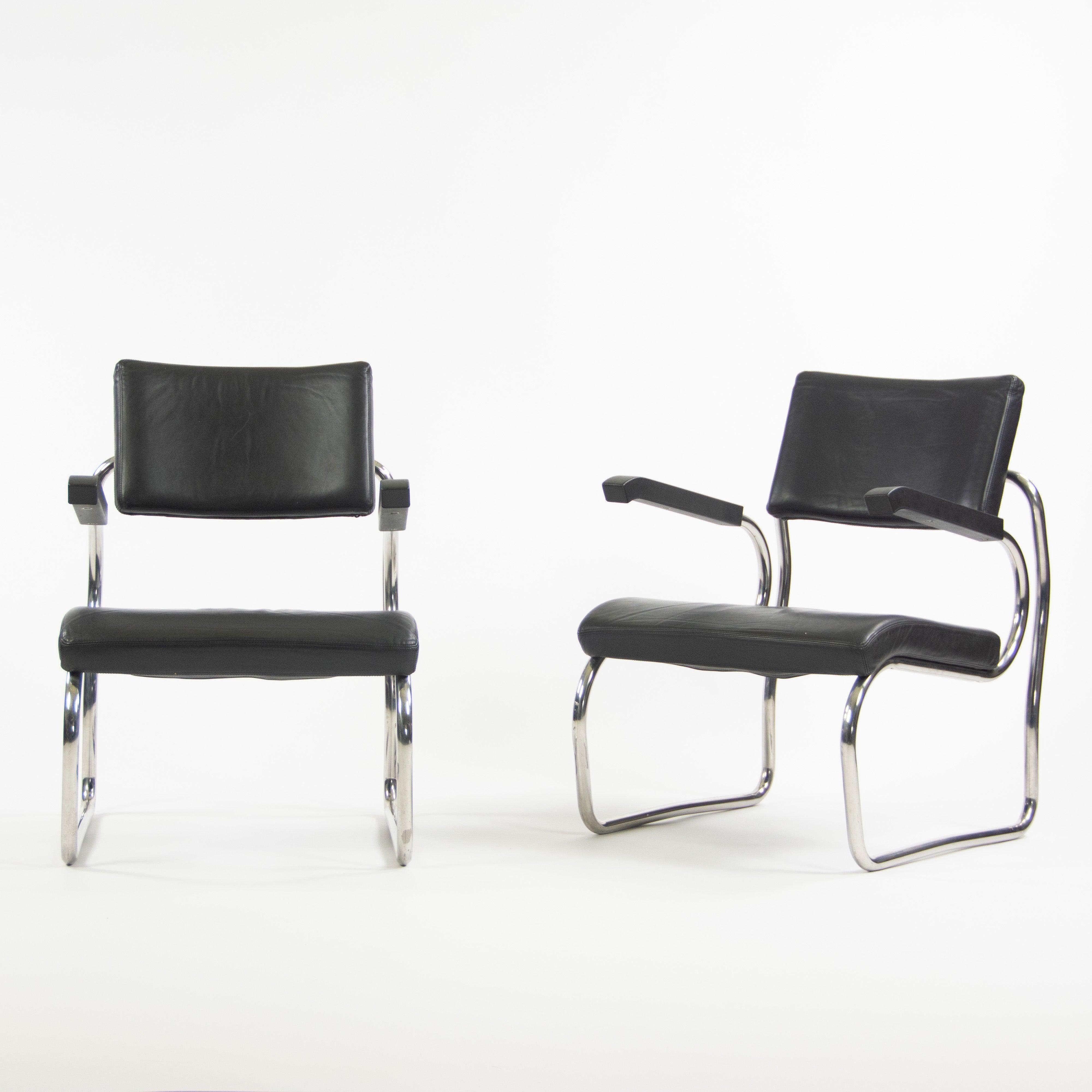 Listed for sale is a pair of gorgeous black leatherSant'elia armchairs by Giuseppe Terragni for Zanotta. These chairs are very difficult to come by. They are constructed from tubular stainless steel material.

These examples are in very good to