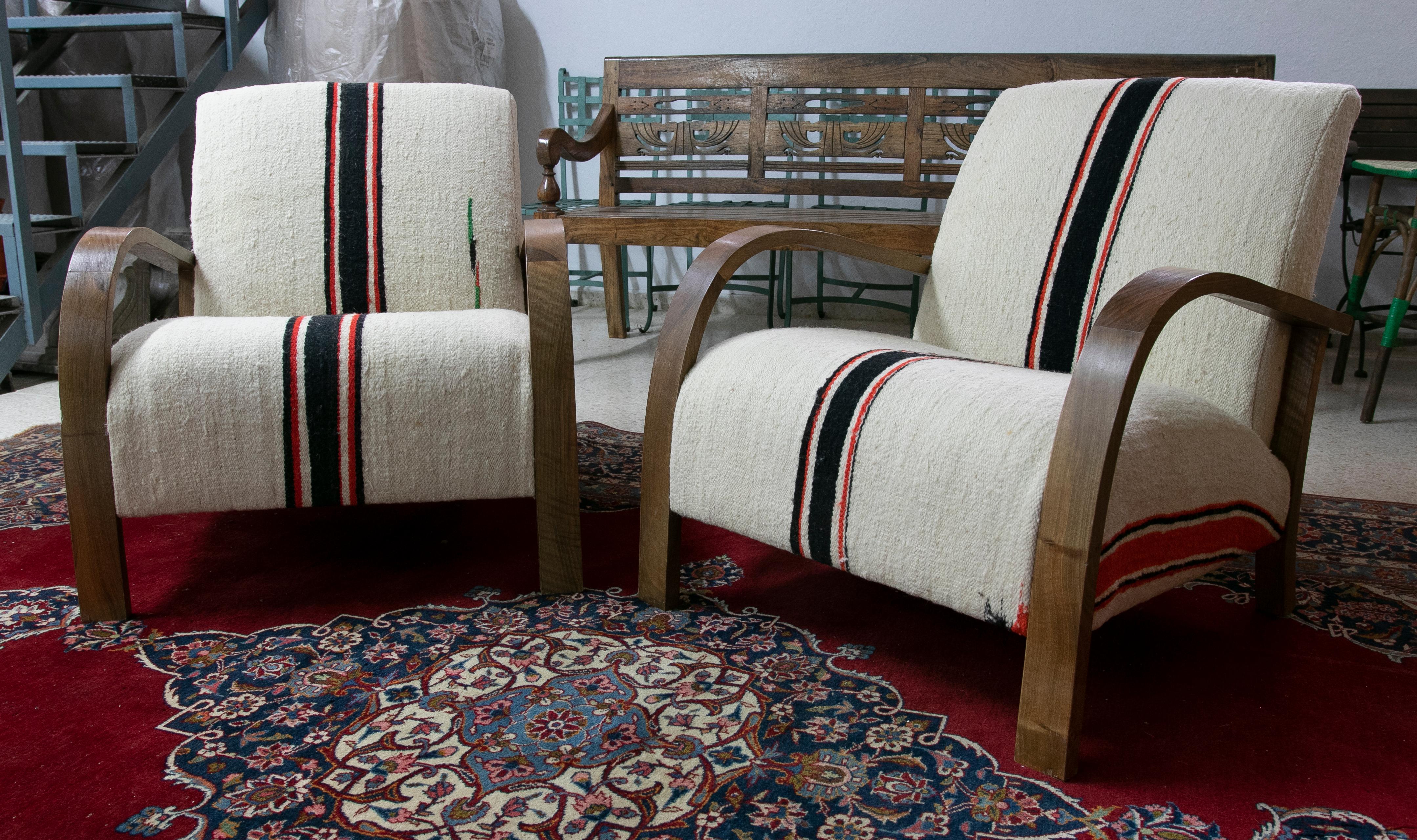 1990s Pair of upholstered wooden armchairs.