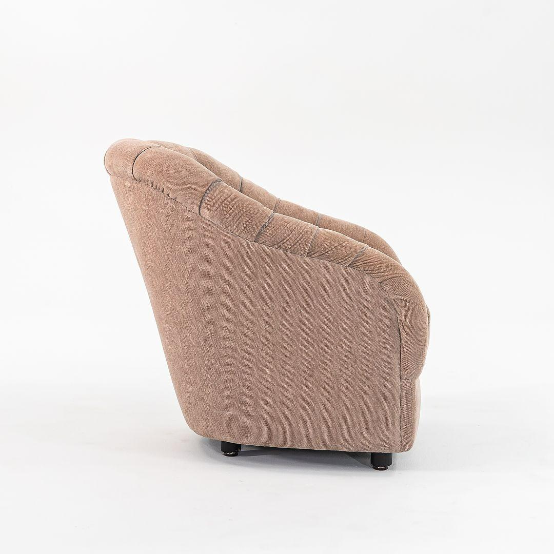 This is a pair of button-tufted velvet club chairs, model 2084, designed by Ward Bennett in 1965. The listed price includes the pair of chairs. This pair was manufactured by Geiger Furniture in the 1990s, as they acquired Brickel Associates in 1993.