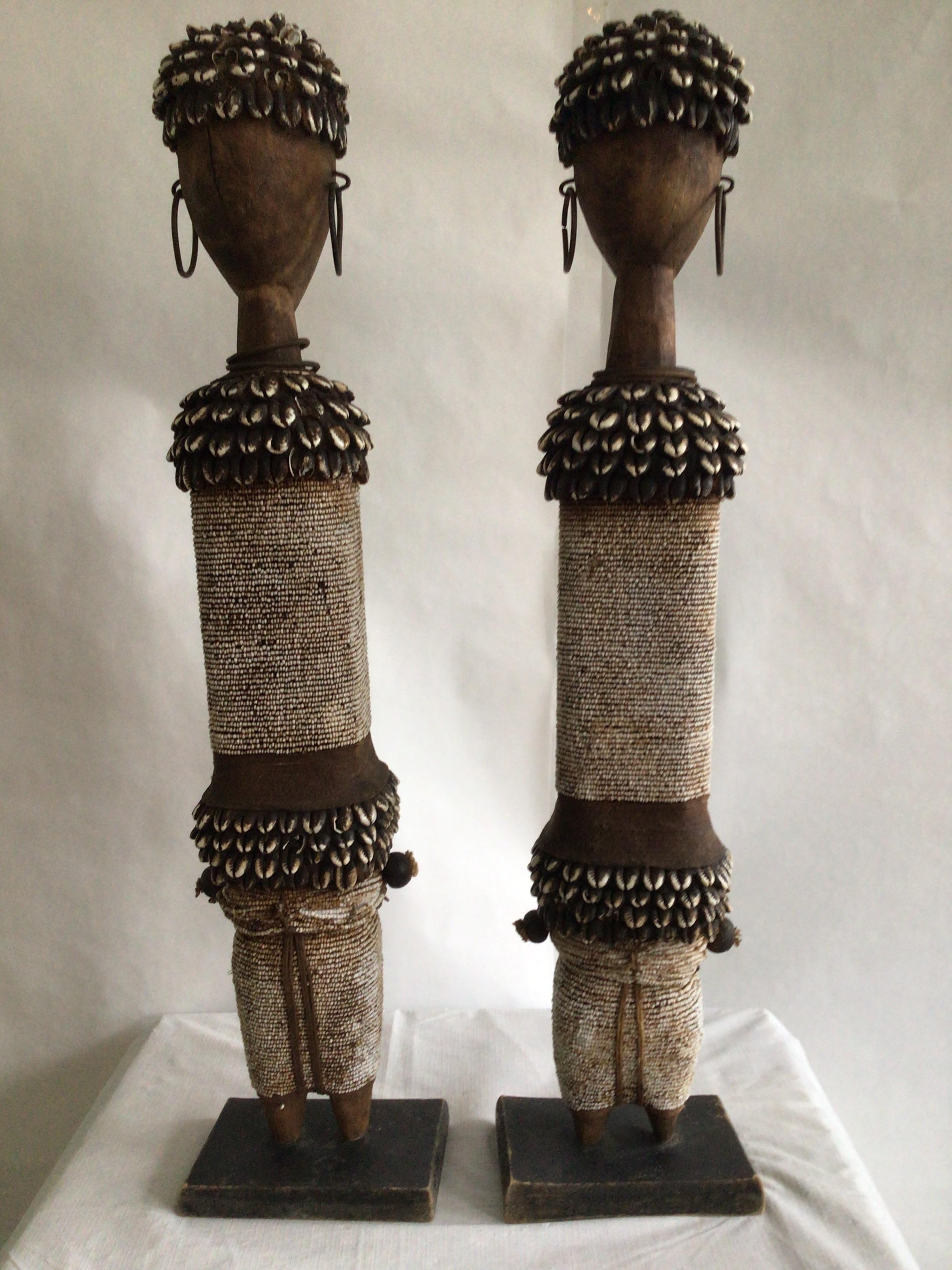 Hand-Crafted 1990s Pair of Wood And Shells Beaded Namji Dolls On Wood Bases For Sale