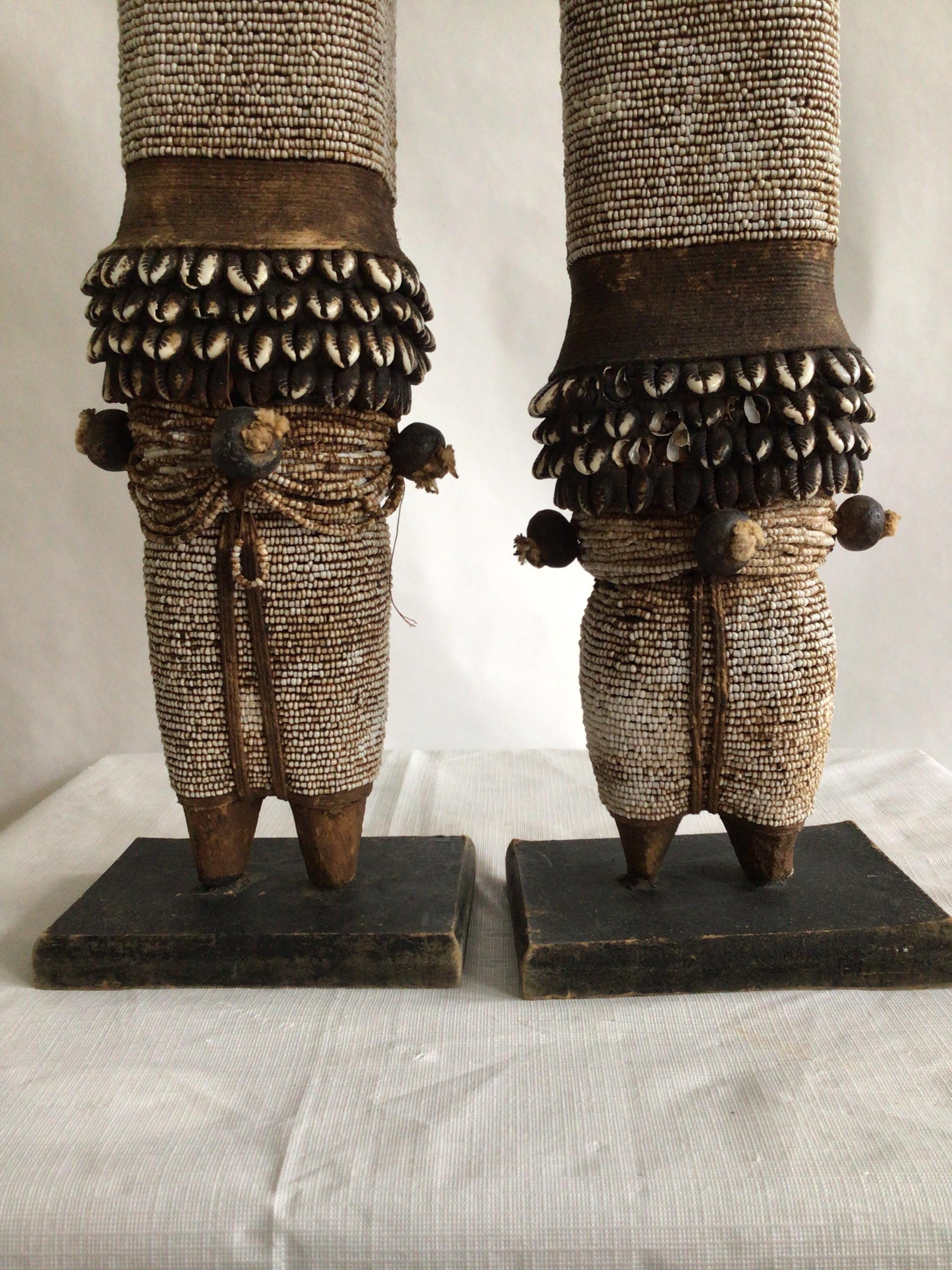 1990s Pair of Wood And Shells Beaded Namji Dolls On Wood Bases For Sale 1
