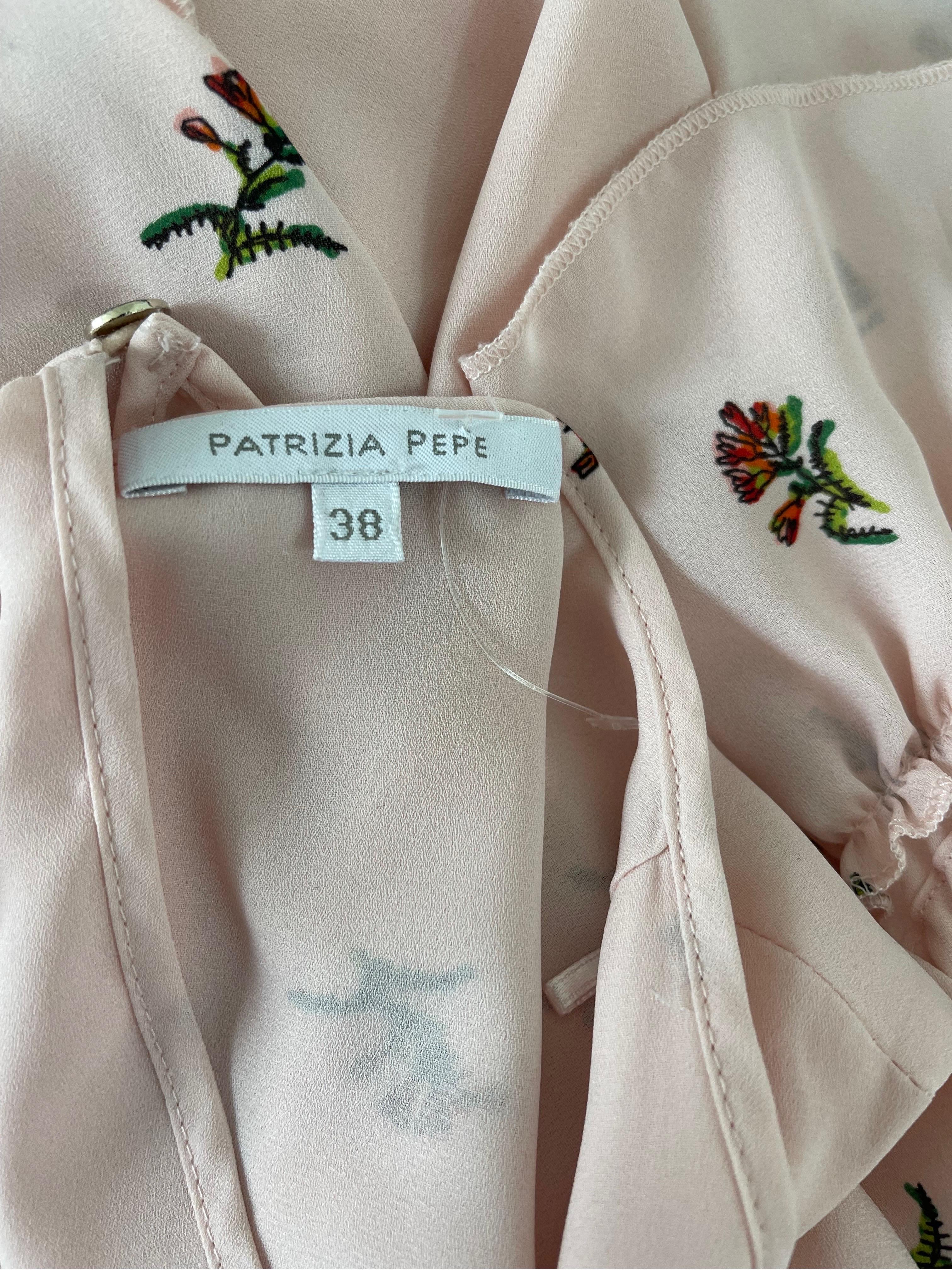 Chic late 90s vintage PATRIZIA PEPE pale light pink novelty vegetable and flower print silk cold shoulder blouse ! Vibrant prints with green, red and orange throughout. Features long sleeves with two tiered ruffles. Button closure at top back center
