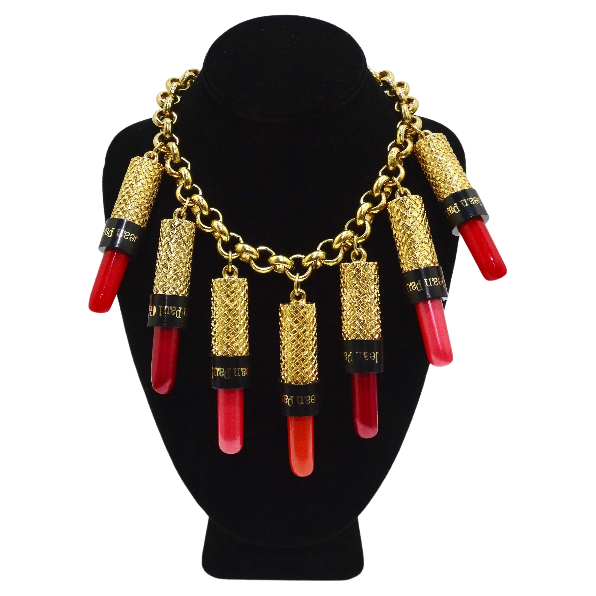 Jean Paul Gaultier collectors assemble! He did not hold back on this design dangled large lipstick pendants to a chunky gold circle link-chain. The lipstick pendants are beautifully textured, feature a classic combo of red and black, and each have