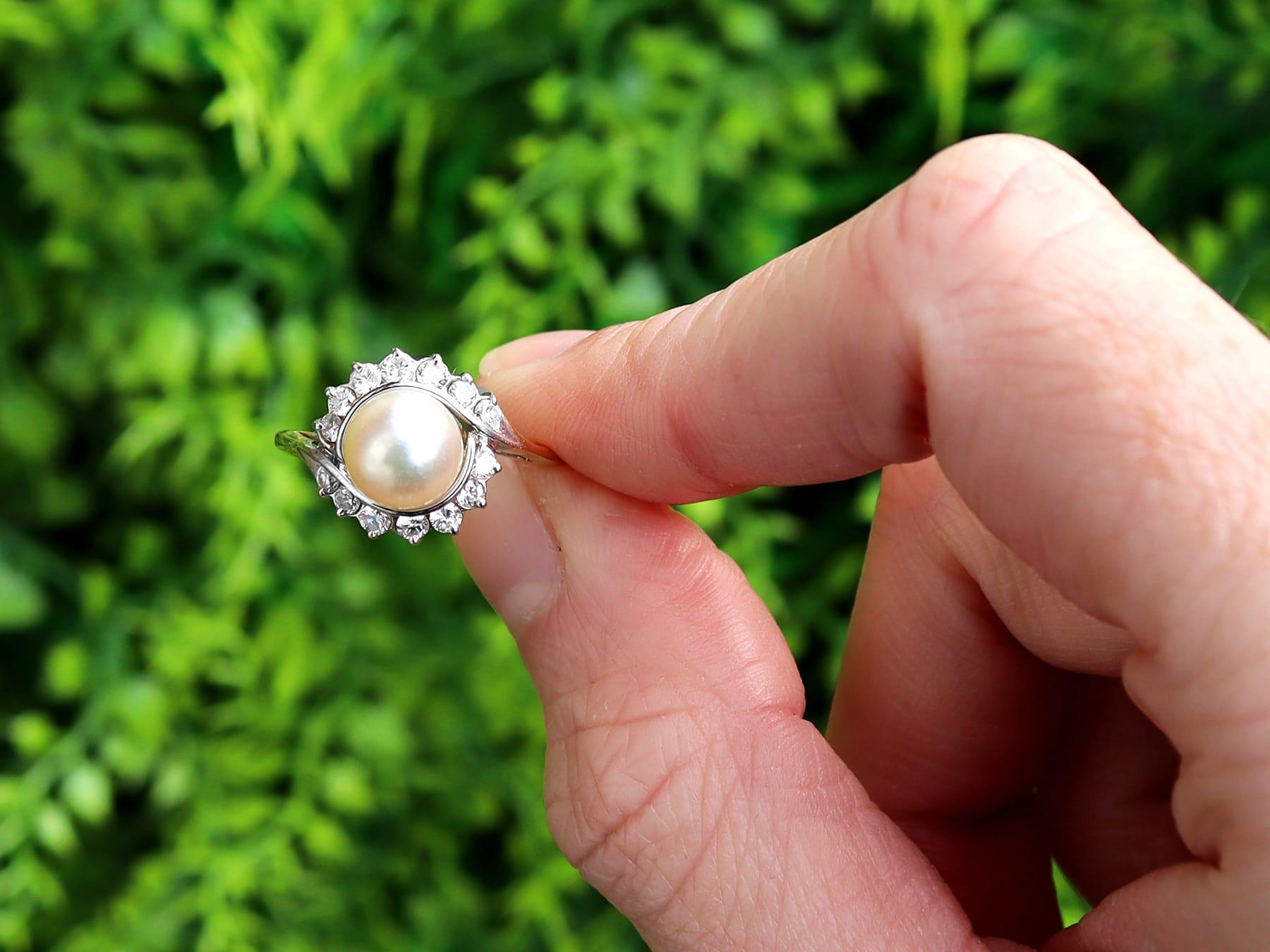 A fine and impressive cultured pearl and 0.33 carat diamond, 18 karat yellow gold and 18 karat white gold set cocktail / dress ring; part of our diverse jewelry and estate jewelry collections.

This fine and impressive pearl and diamond ring has