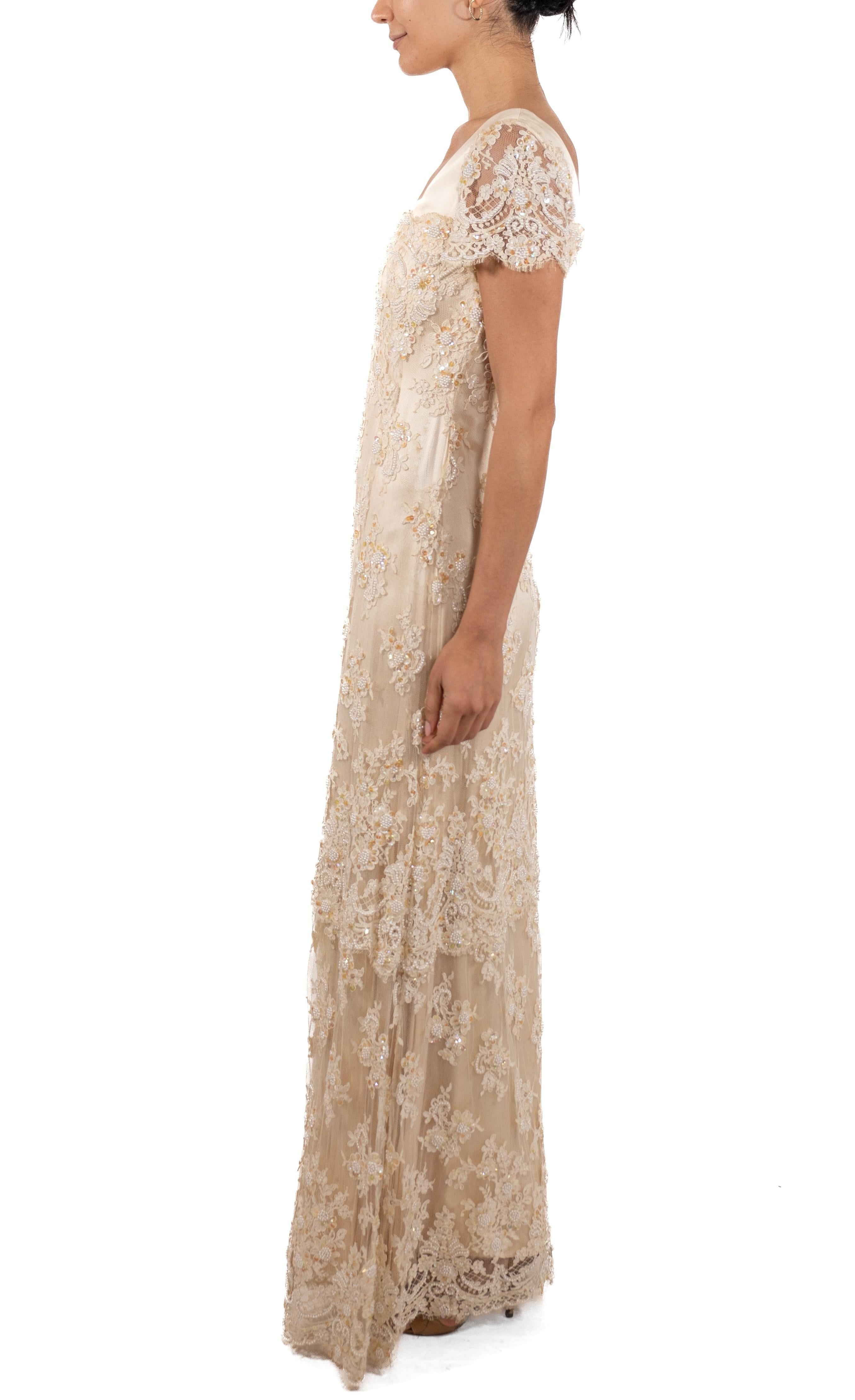 This gown retains no label, however the amount of hand-finishing points to Haute Couture or custom made quality, fully lined in silk. 1990S Pearl White Beaded Silk & Lace Titanic Inspired Empire Waist Gown With Short Sleeves 