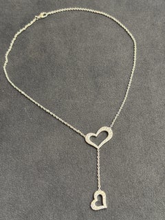 1990s Piaget 18k gold and diamond heart pendant