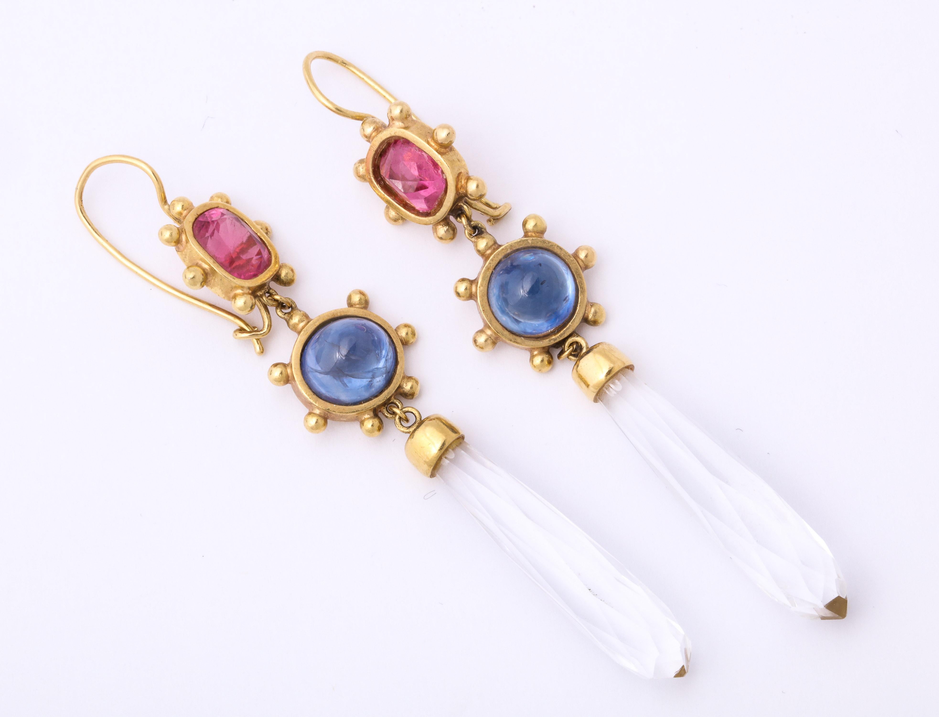 One Pair Of Ladies 18kt Yellow Gold Drop Earrings designed with Two Faceted Pink Tourmalines weighing approximately 2 Carats each and further Embellished With 2 Cabochon beautiful color sapphires weighing approximately 2 carats each . Earrings are
