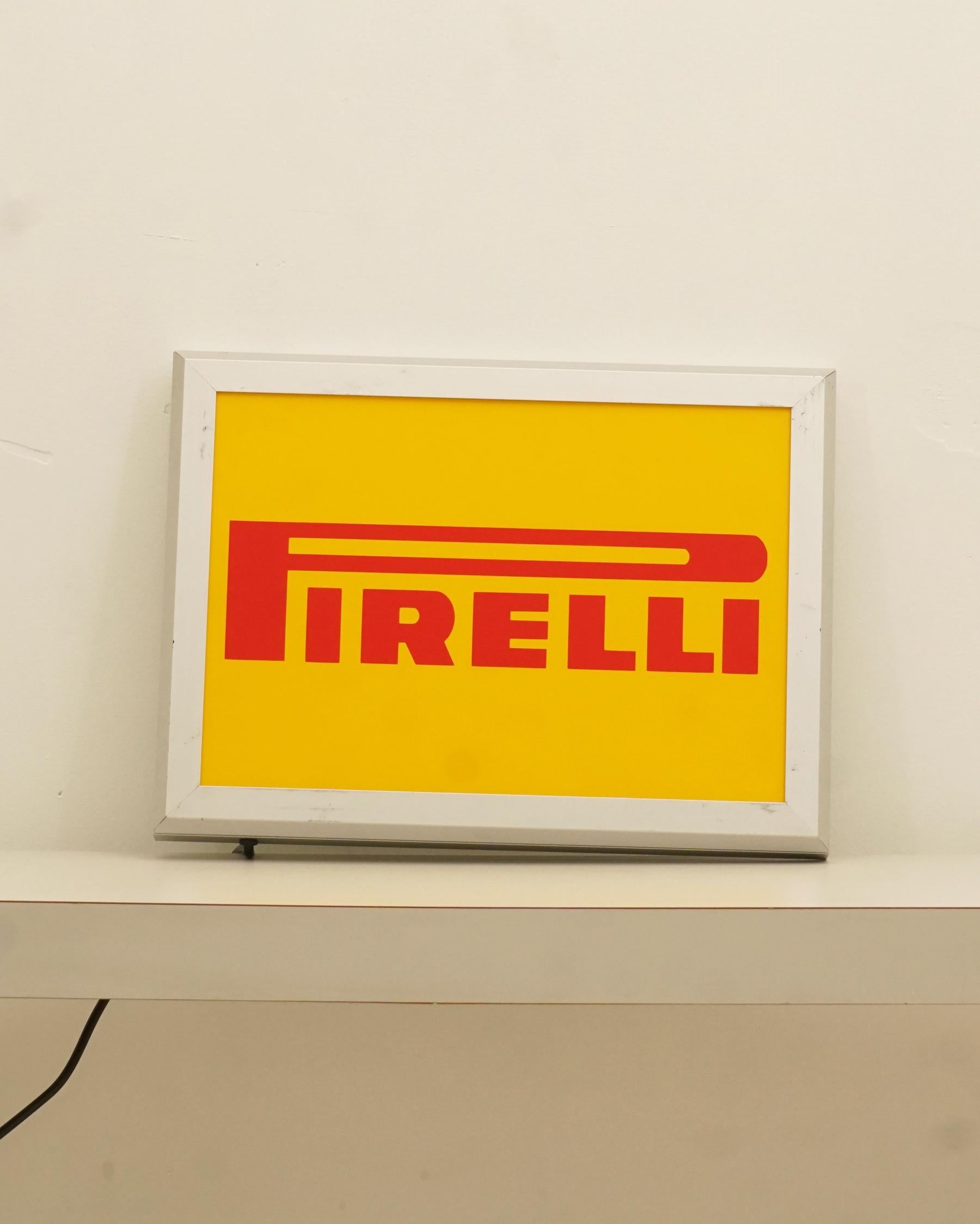 1990s Pirelli Tires advertising sign. Sign made of steel and plexiglass, with the Pirelli logo and a protective plate. Made in the Netherlands. In near new condition. Has been retrofitted with LED lights and a North American plug. All original parts