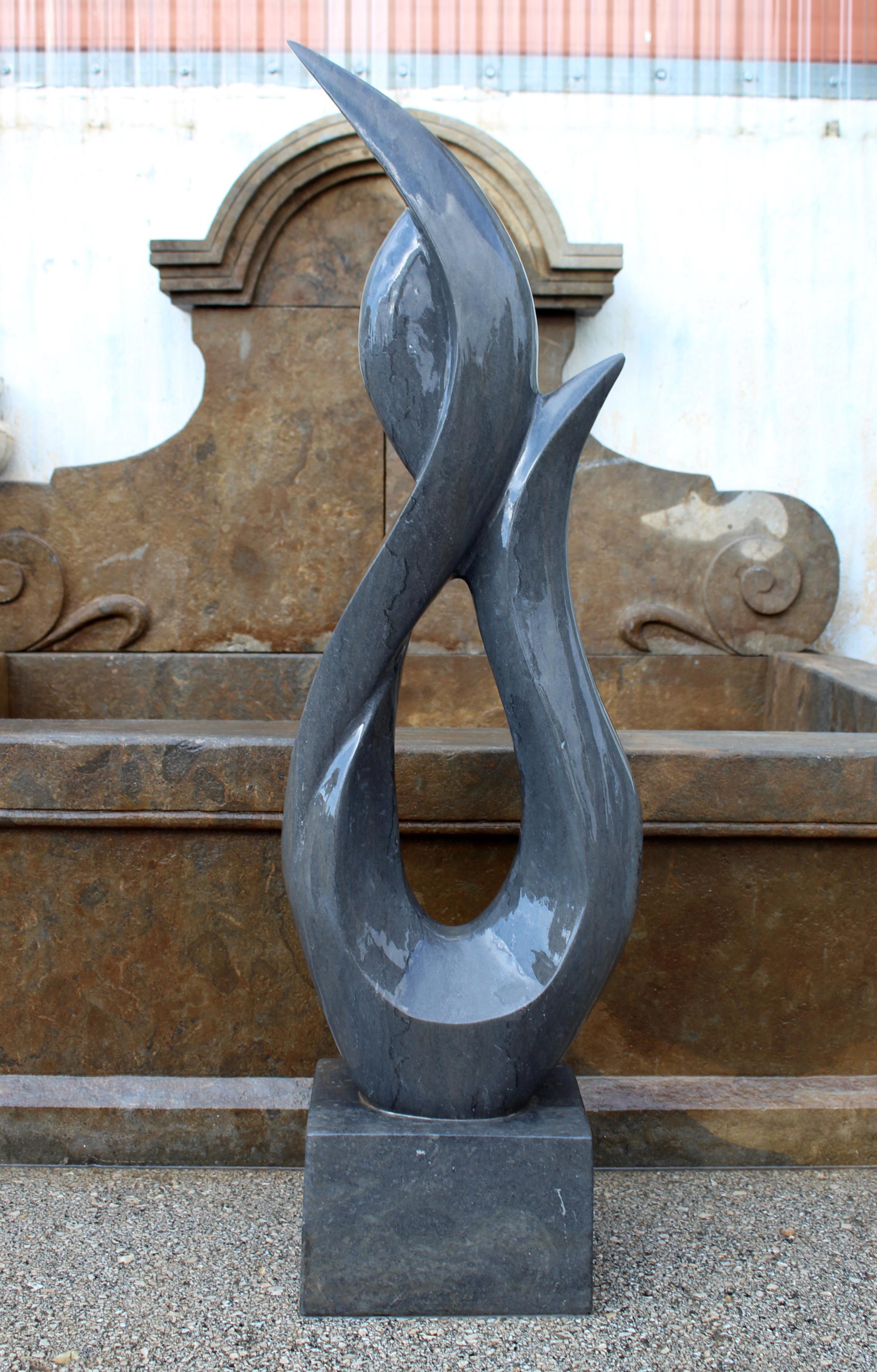 1990s polished modern abstract sculpture in hand carved black Belgian marble.