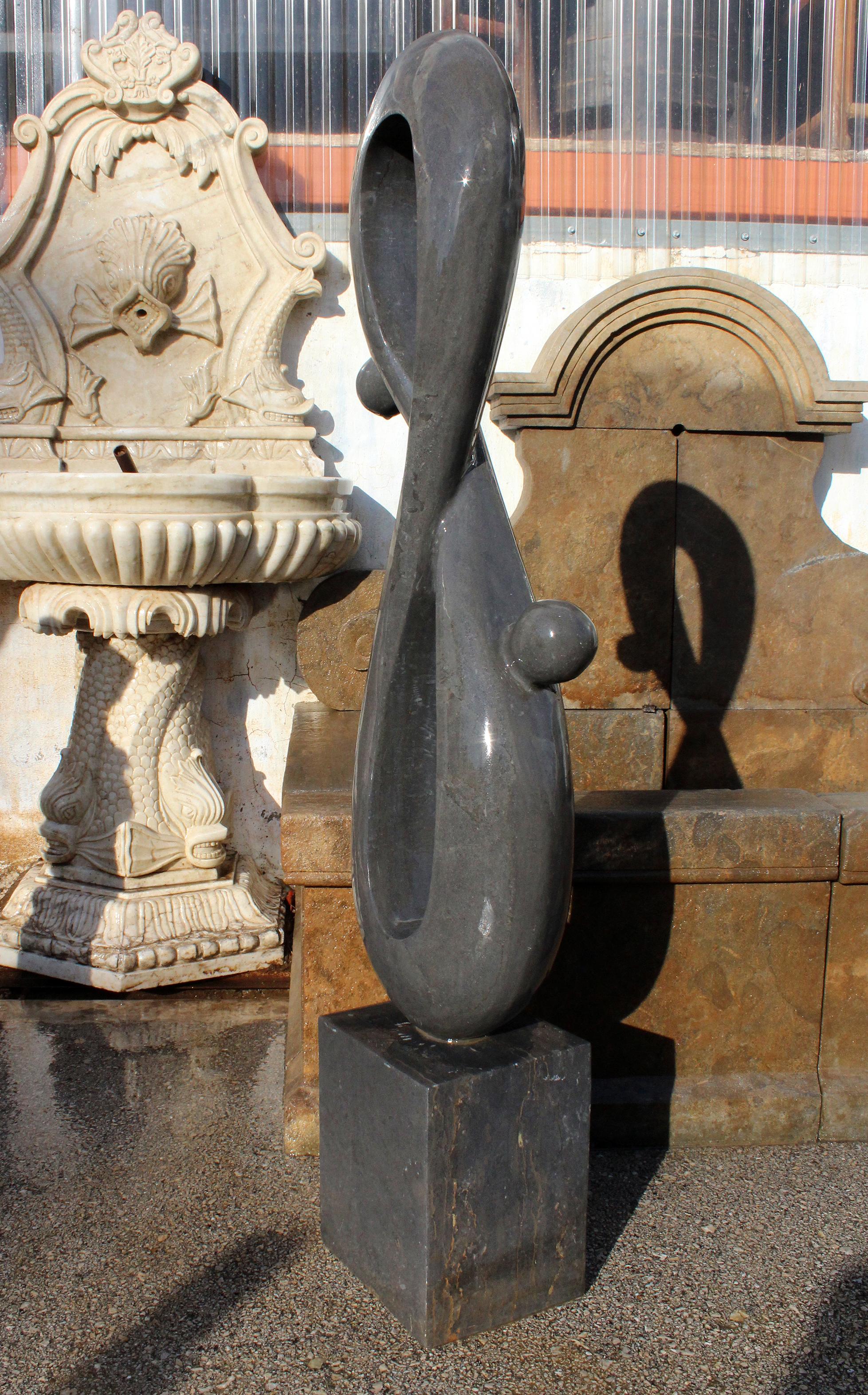 1990s polished modern abstract sculpture with square base in hand carved black Belgian marble.