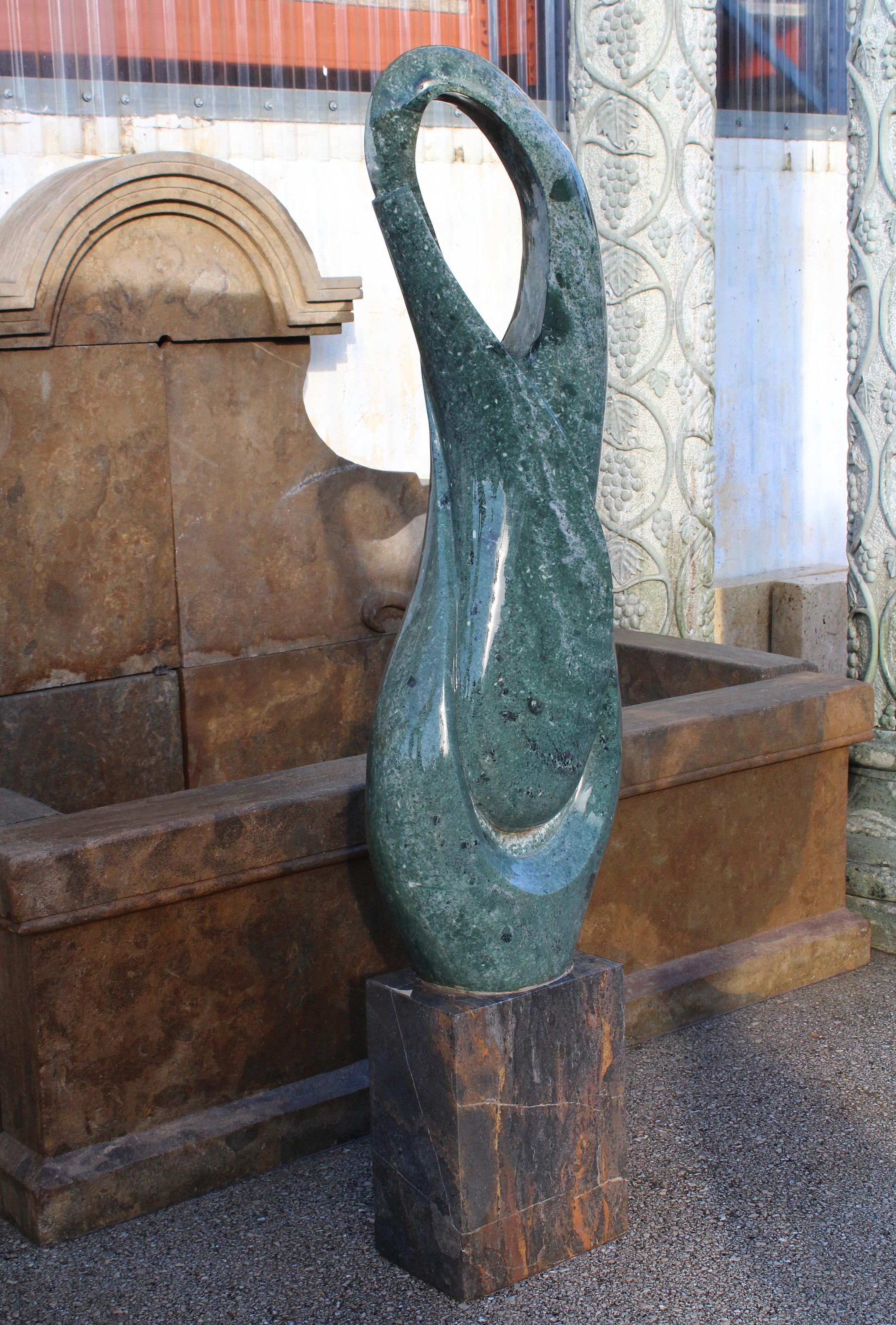 1990s polished modern abstract rounded sculpture in hand carved rounded green serpentine marble shapes on a square Italian Nero Portoro marble.