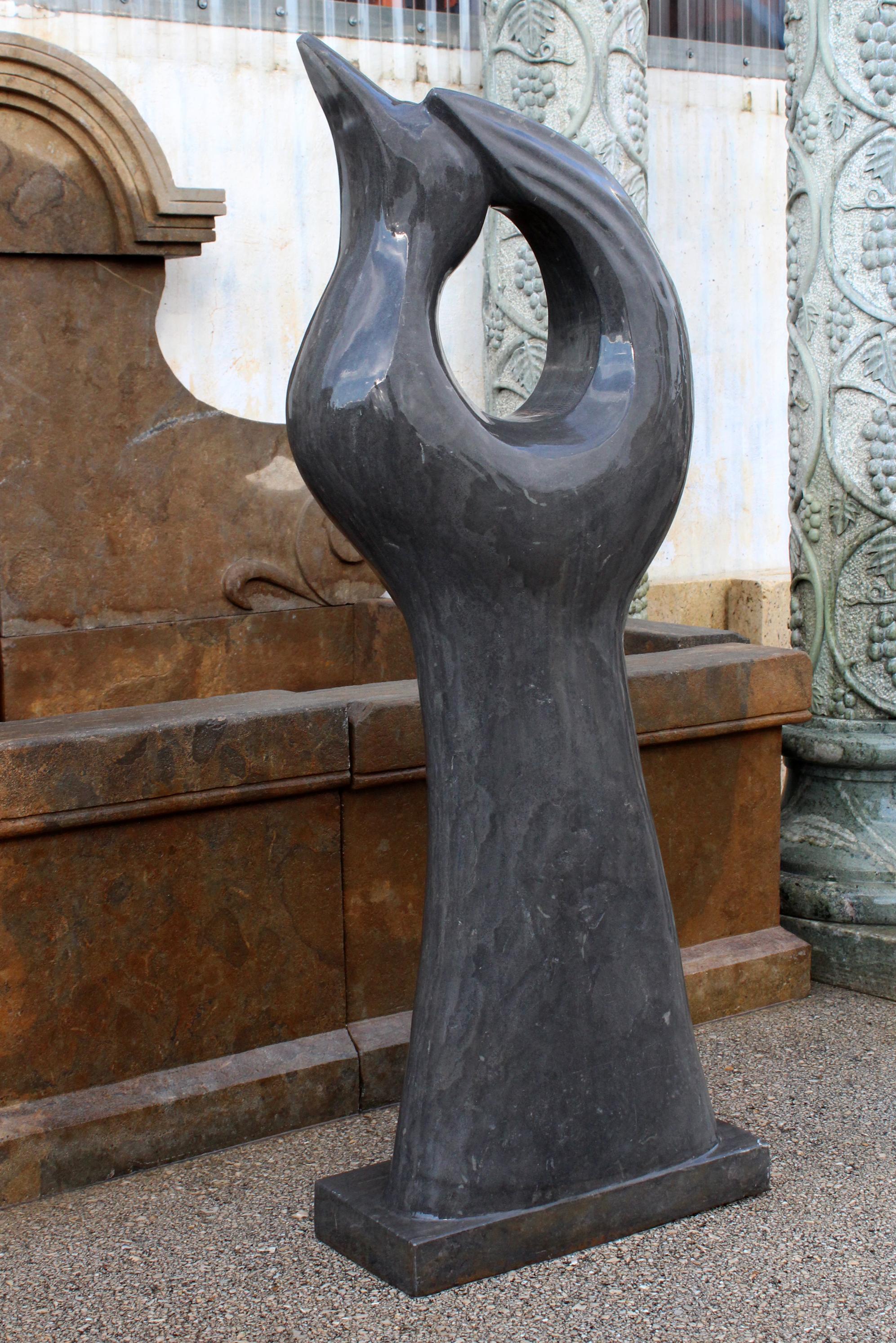 1990s polished modern abstract sculpture of a dove in in hand carved black Belgian marble.