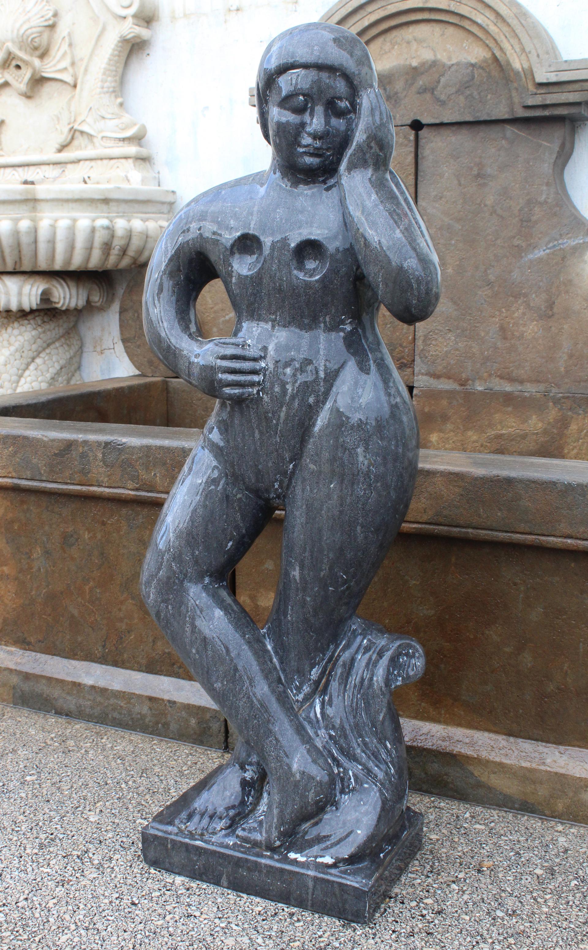 1990s polished modern figurative woman sculpture hand carved in pure Belgian black marble.

