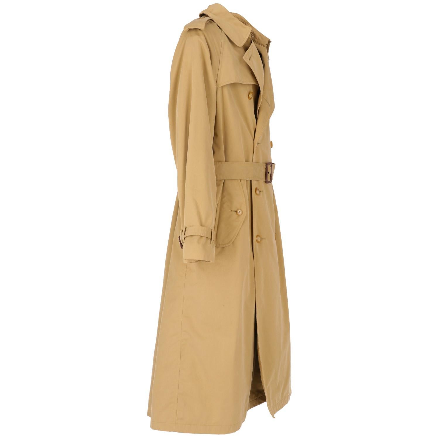 Classy Polo by Ralph Lauren trench coat for the elegant man. In beige blend cotton, with tartan lining and a second removable blend wool lining . The item is vintage it was produced in the 90s and is in good conditions, but the belt misses one ring