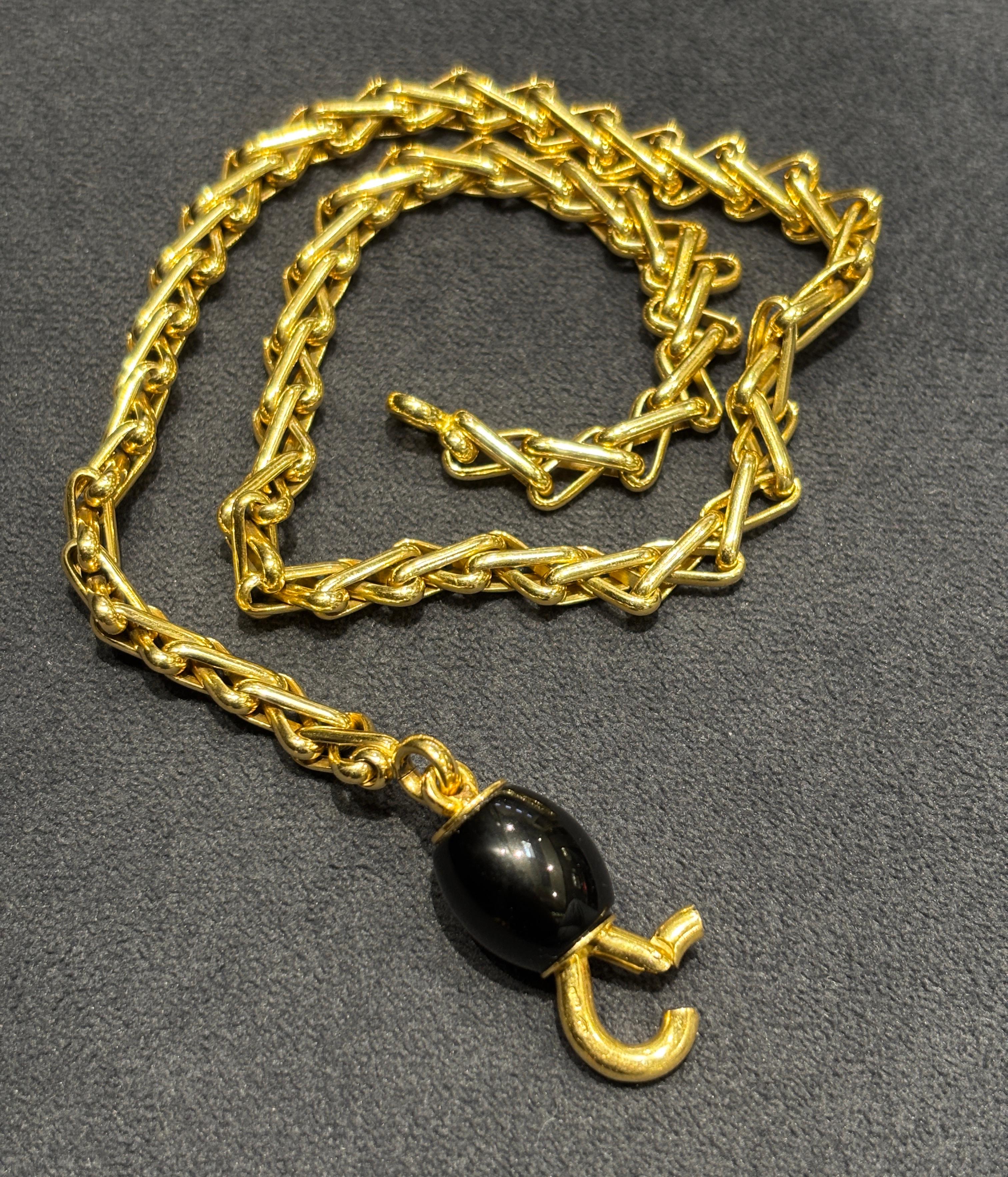 This elegant gold chain from Pomellato is made of 18k gold which beautifully accentuates the single onyx bead positioned next to its chunky clasp. A classic piece which can be work evening and night.