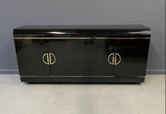 1990s Post Modern Black Laminate Rounded Credenza with Brass Handles and Trim