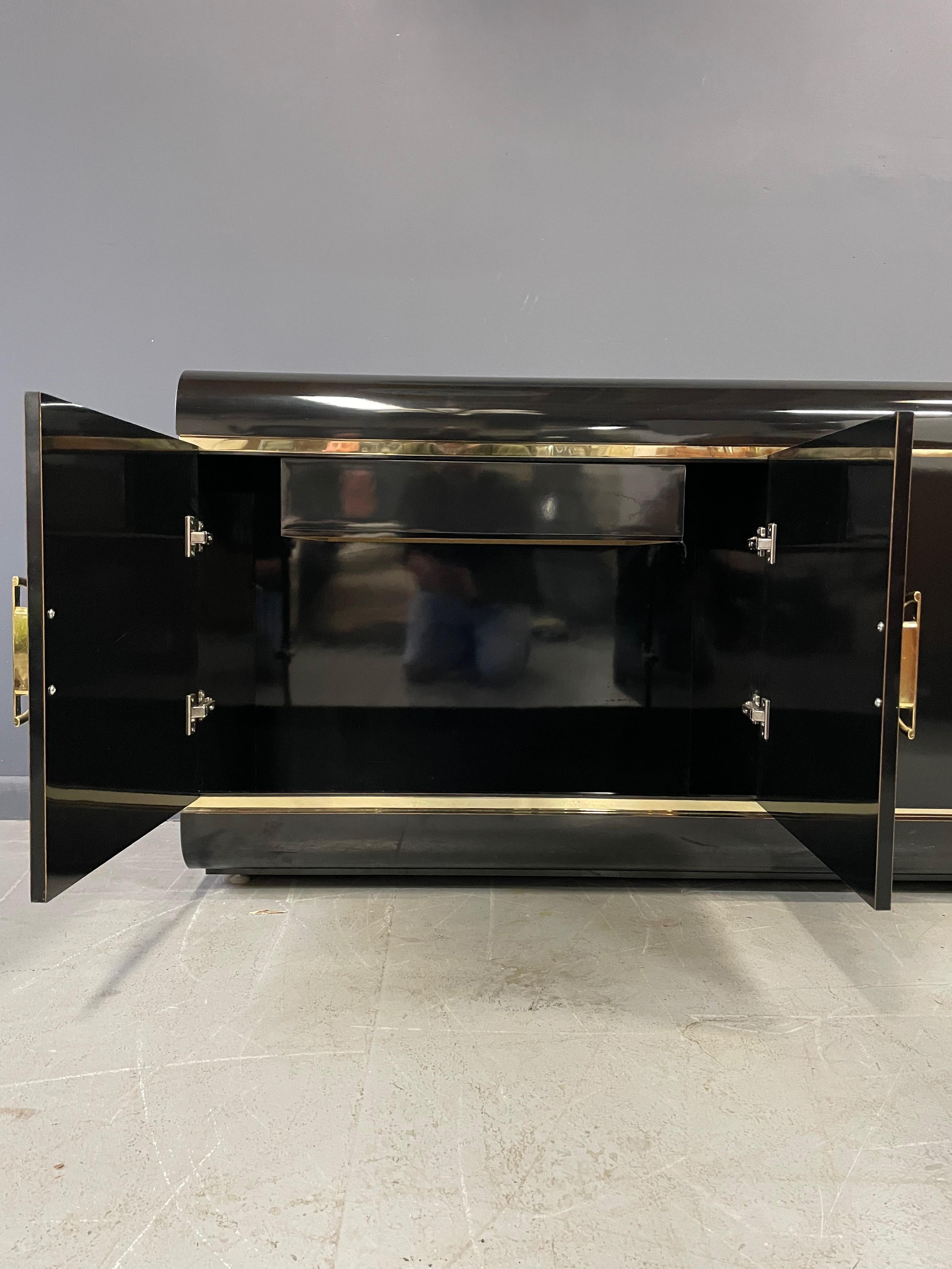 1990s Post Modern Black Laminate Rounded Credenza with Brass Handles and Trim In Good Condition In Philadelphia, PA