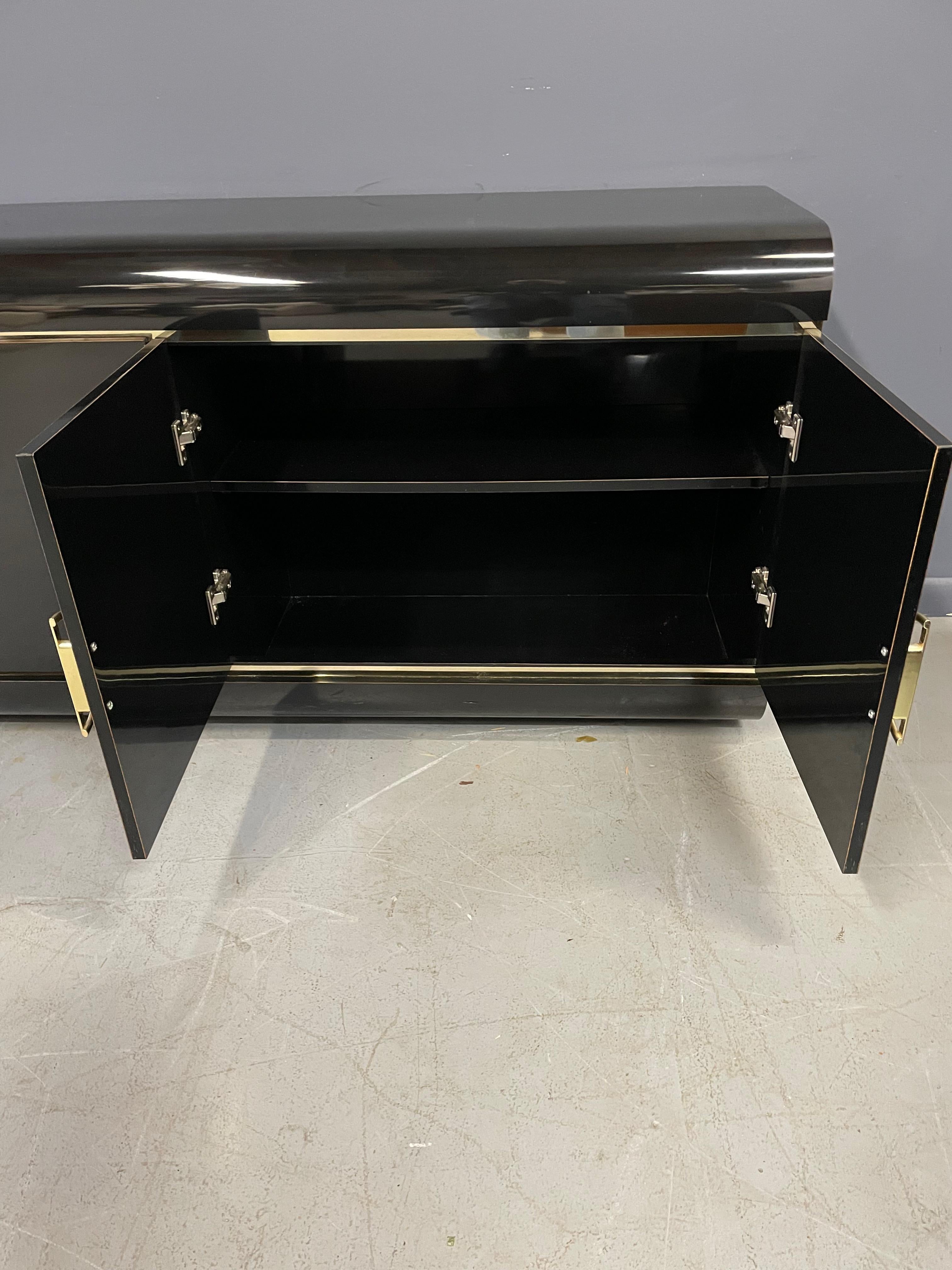 20th Century 1990s Post Modern Black Laminate Rounded Credenza with Brass Handles and Trim