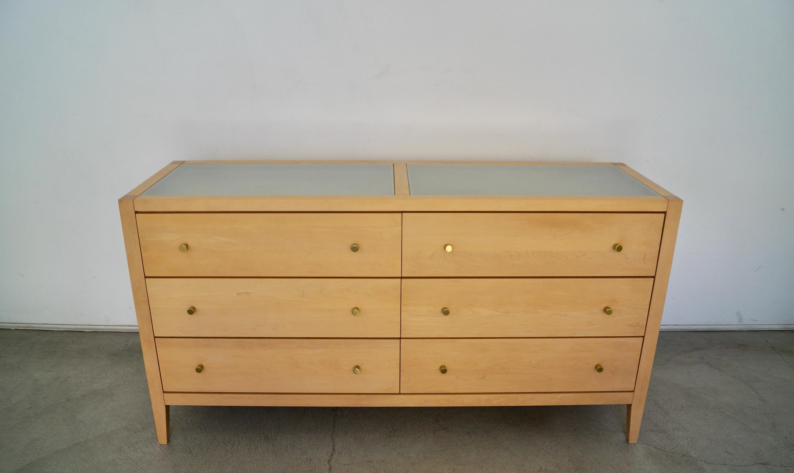 Vintage post-modern dresser for sale. Manufactured in 1998 by Baronet Furniture, and made in Canada. It's made of solid maple, and has two frosted glass inserts on the top. It has aluminum knobs in a brass finish. It's a really high-quality dresser