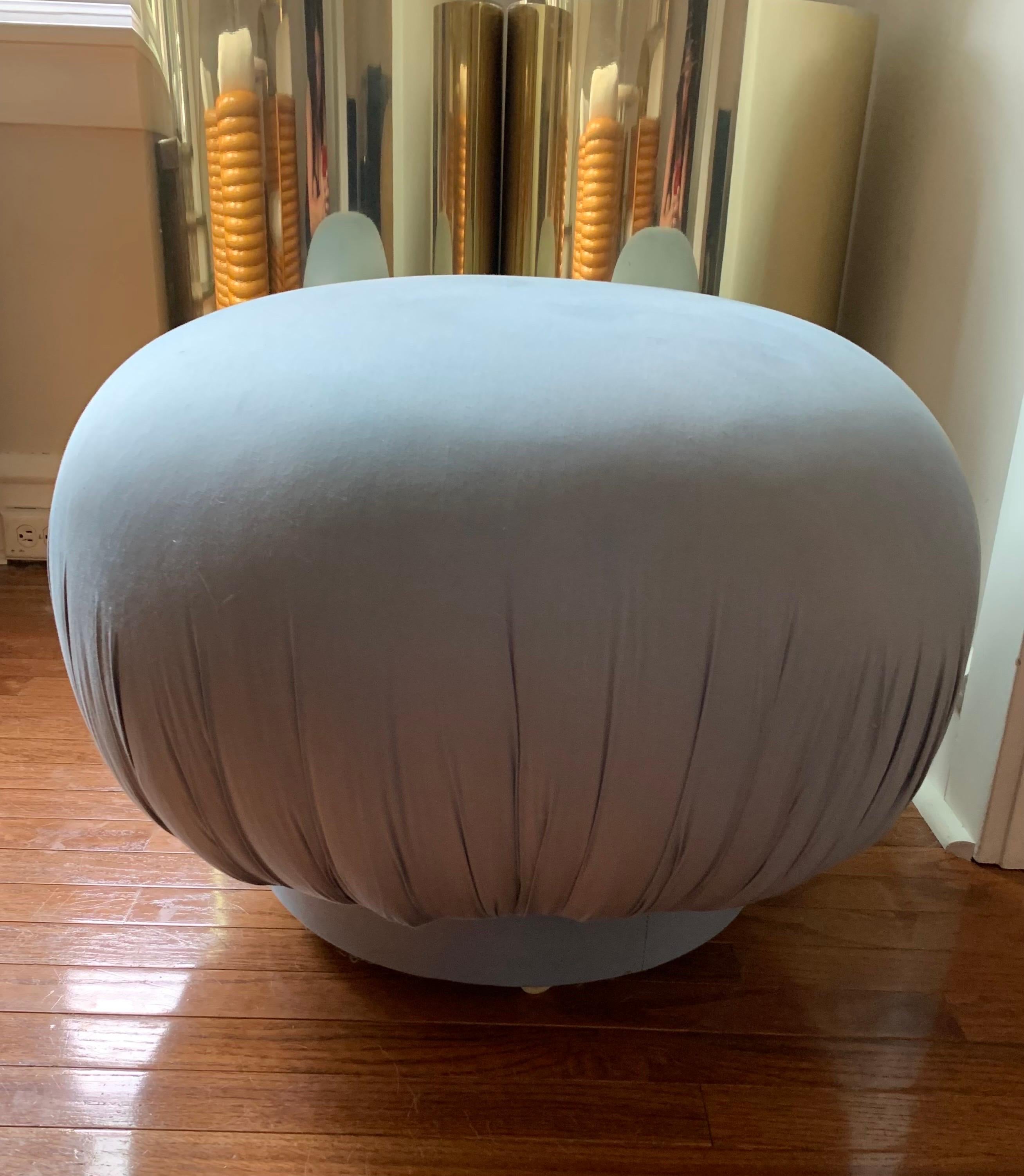 This periwinkle blue chintz pouf ottoman not only swivels, but it also has hidden casters… lots of excitement for a seemingly simple pouf. 

It is a solid piece, purchased from a home that was outfitted with other items labeled Directional, so we
