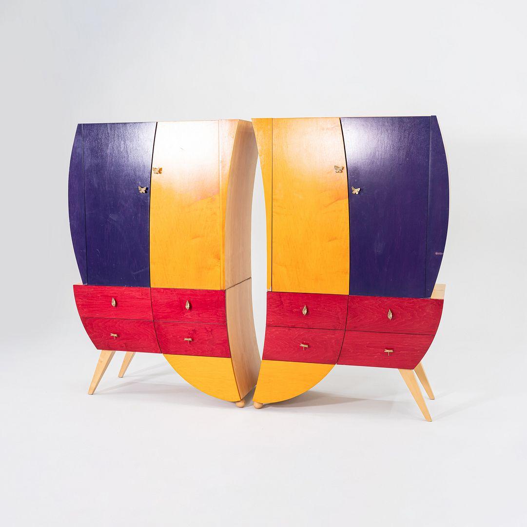 This is an unusual Postmodern Studio Craft Sculptural Armoire in Aniline-Dyed Maple, dating to the 1990s. We also have a coordinating right-leaning armoire available for separate purchase. The cabinet was handcrafted from solid woods, and has a