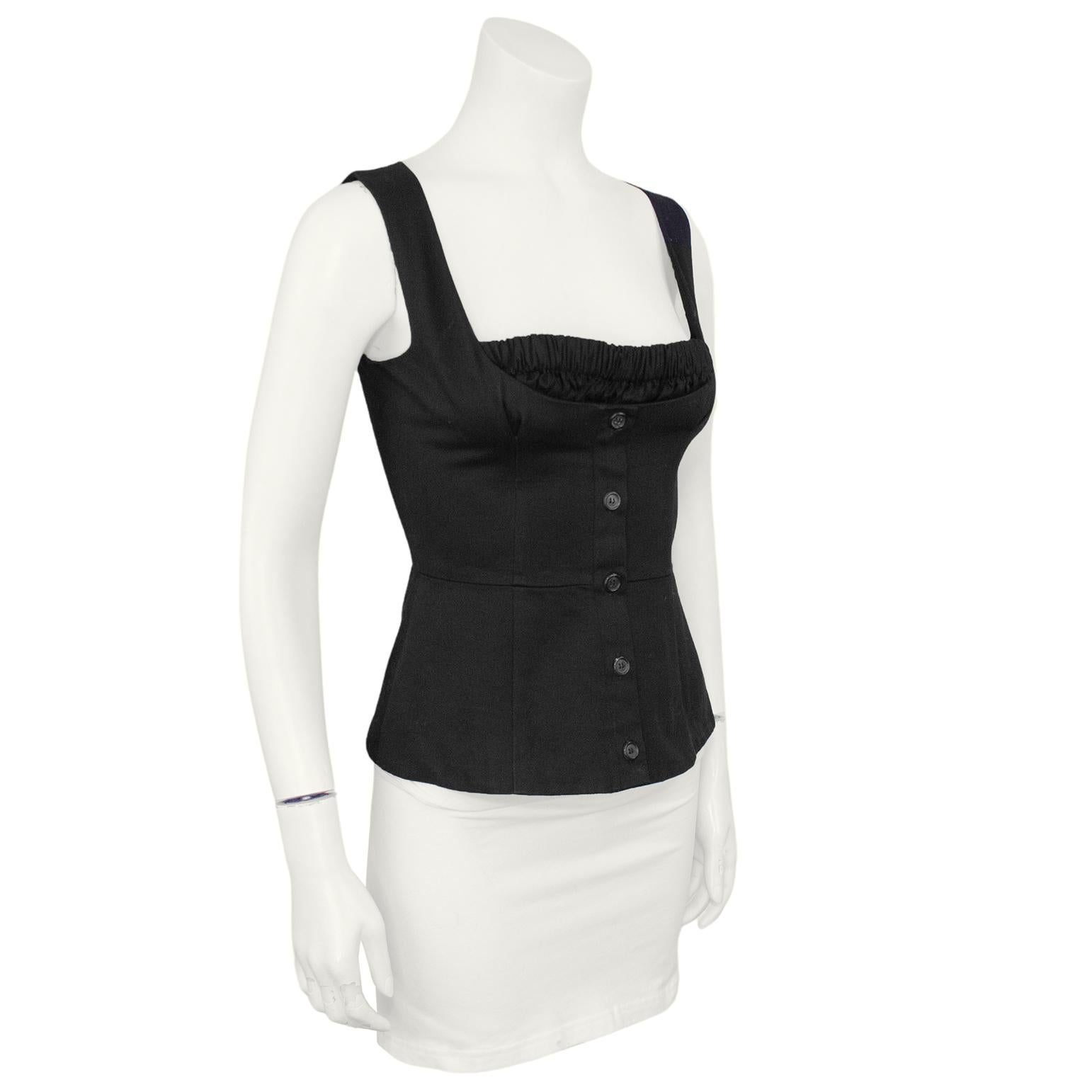 Very chic Prada top from the 1990s. Black cotton twill sleeveless bustier style with elasticated ruching at the bust. Faux buttons down the placket, invisible zipper at left side seam. Excellent vintage condition. Made in Italy. Marked size IT 40,