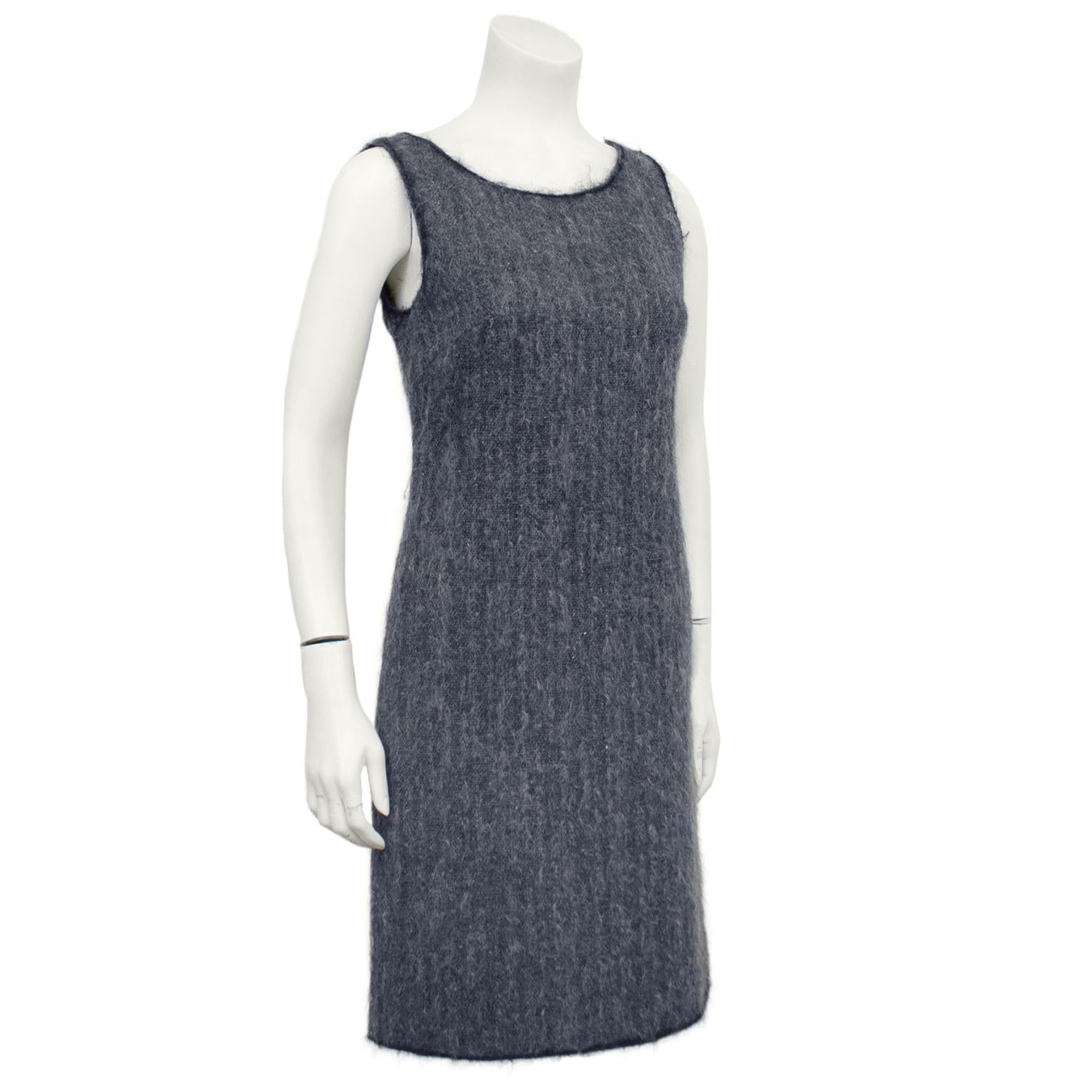 1990s Prada shift dress. Grey wool and mohair with subtle contrasting black trim at the neckline, sleeves and hem. Round neckline and sleeveless. Invisible zipper up centre back. Excellent vintage condition. Fits like a US size 4. Classic shape,