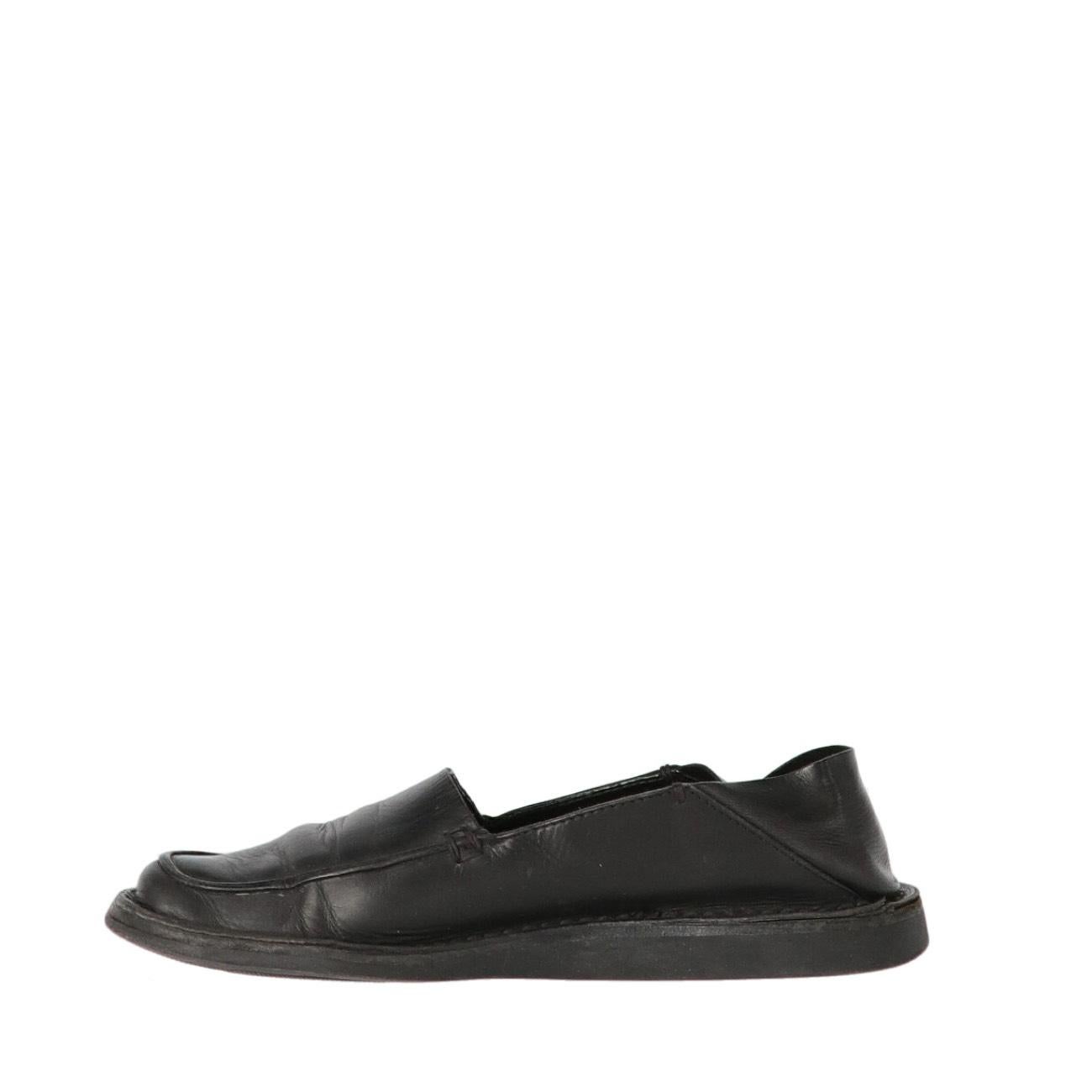 Prada black soft and supple leather loafers. This loafer is designed to be worn with the heel folded down as a slipper or up as a loafer.

The shoes show signs of wear and wrinkles on the leather, as shown in the pictures.
Years: 90s

Made in
