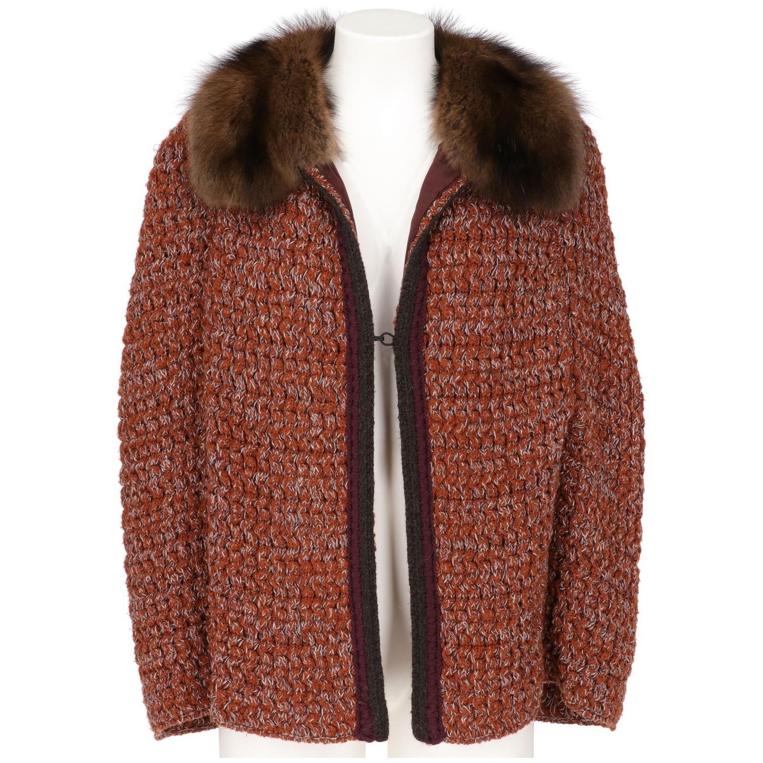 Prada short bell cape sweater, made with rust orange wool knitting with white threads, with wide classic collar in soft genuine brown marten fur, hook and eye fastening with grey and purple knitted edges, armholes on front and purple silk