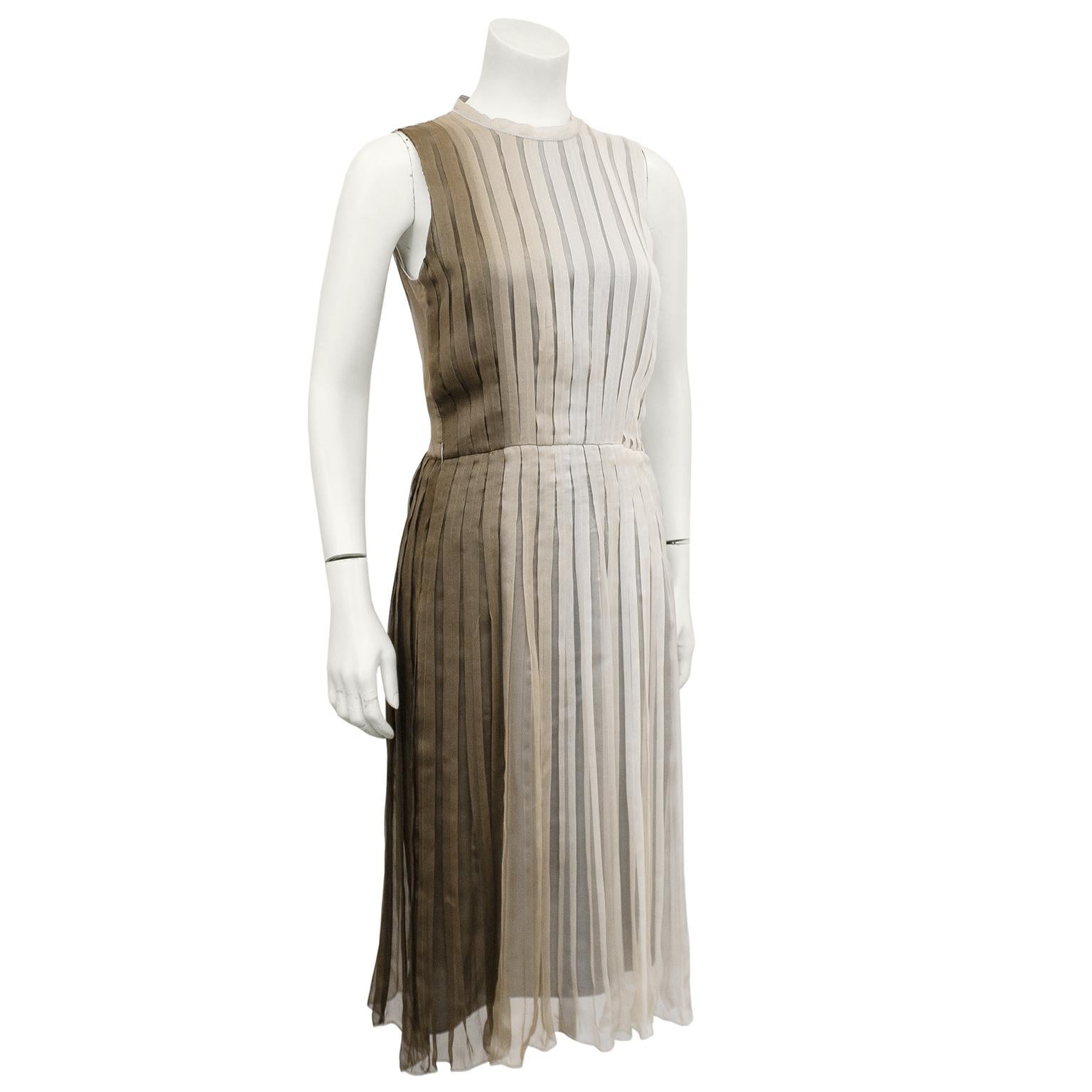 Beautiful 1990s Prada taupe ombre pleated chiffon dress. Woven ombre dyed silk tape crew neckline with top stitching details. Slight A line shape with accented waist. The ombre goes from taupe on the right to light mocha on the left. No pleats on