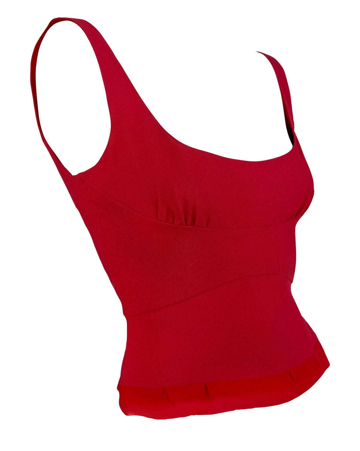 This 1990s Prada bustier crop top is crafted in a rich red silk chiffon  and trimmed with a delicately flared hem. Designed with a softly structured bodice and wide straps, the top balances elegance and minimalism.

Approximate measurements:
Size -