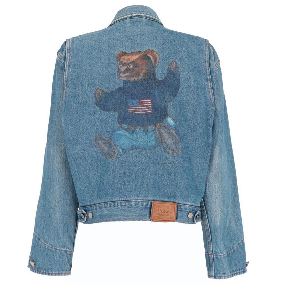Ralph Lauren blue cotton denim jacket. Classic collar and front closure with logoed metal buttons. Cuffs with button, four pockets and teddy bear printed on the back.

Size: M

Flat measurements
Height: 55 cm
Bust: 54 cm
Shoulders: 50 cm
Sleeves: 57