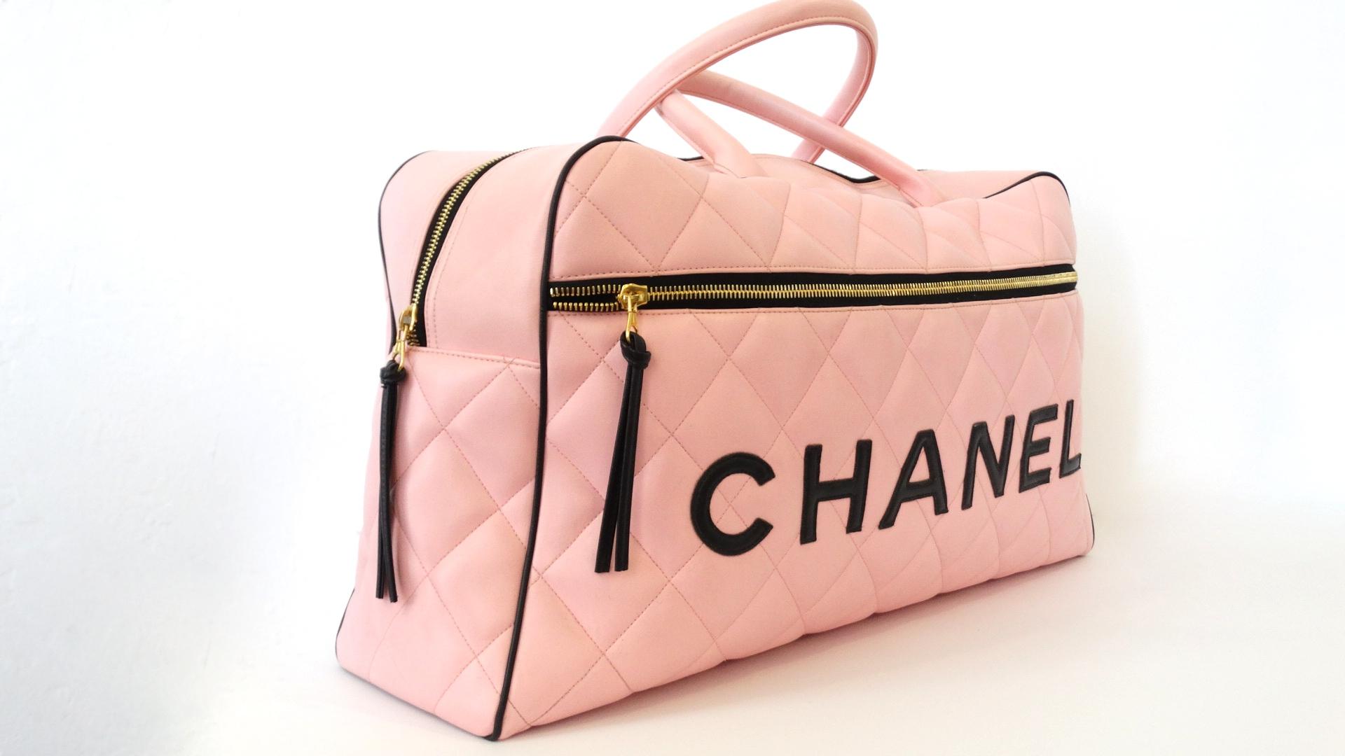 Channel your inner 1990s socialite with our adorable baby pink Chanel Boston duffle! Created circa 1994-1996, a bonafide piece of Lagerfeld's design legacy at this iconic fashion house. Made of a soft pink lambskin leather and stitched with Chanel's