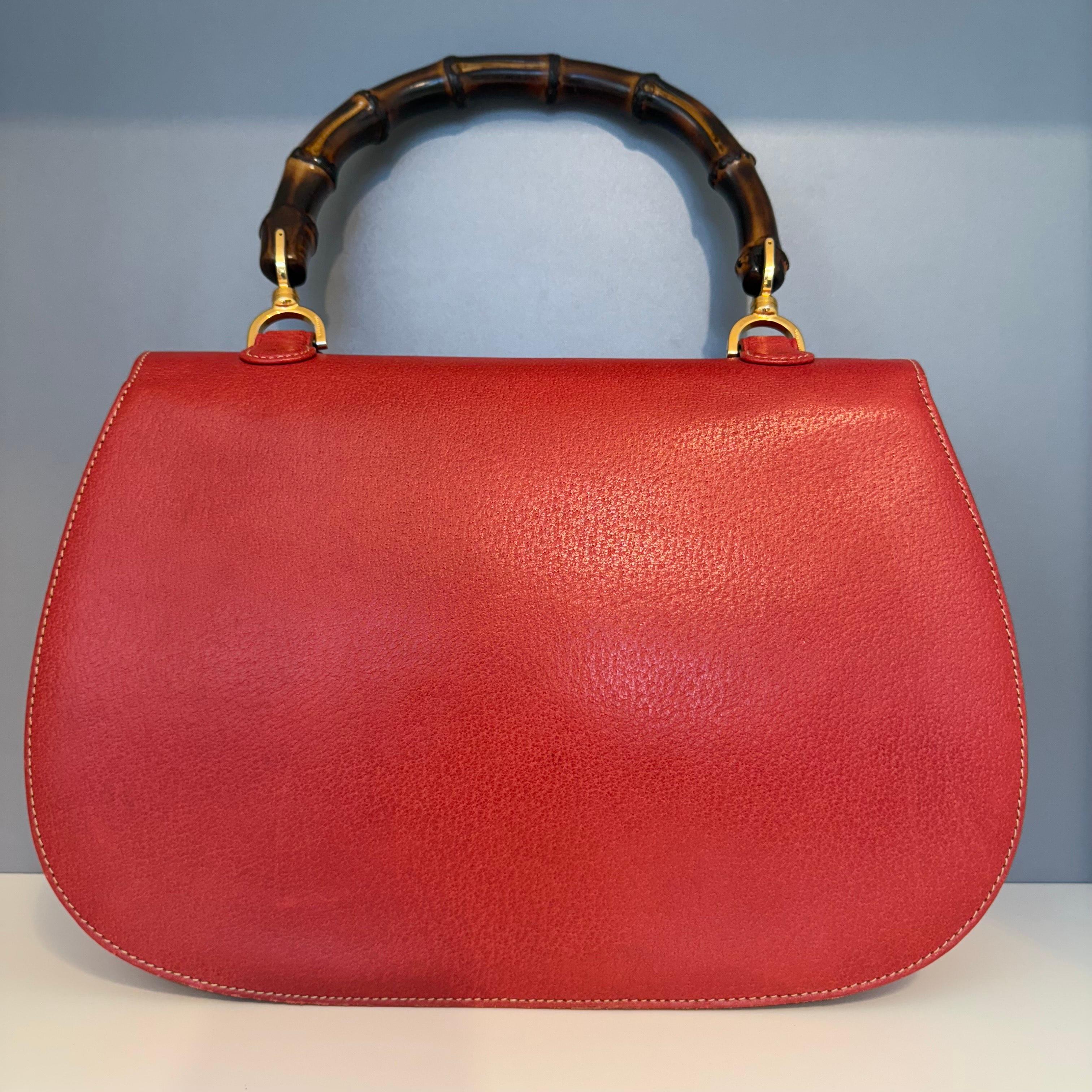 Wonderful, rare and precious Gucci Bamboo bag
A myth and iconic bag
Vintage from the 90s
Leather
Red color
Large size, cm 31 x 20 x 12 (12.2 x 7.87 x 4.72 inches)
Bamboo handle and closure 
Golden brass hardware
Three pockets inside, one with