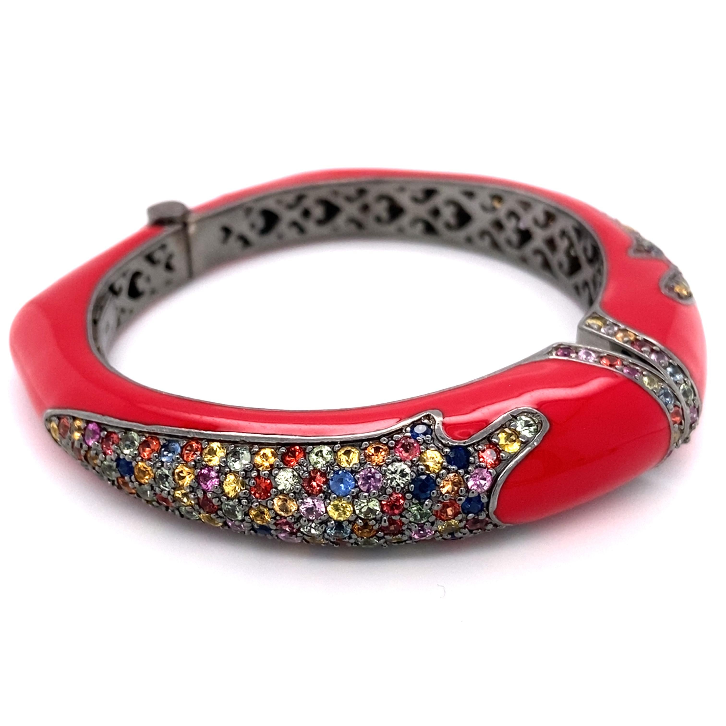 Item Details: 
Metal: Sterling Silver
Weight: 75 grams 
Measurements: 2.5 inches across x 2 inches high (Inside Bracelet)

Item Features: 
This beautiful multi-gem stone bangle features 5 carats of assorted sapphire, topaz, and quartz all crafted in