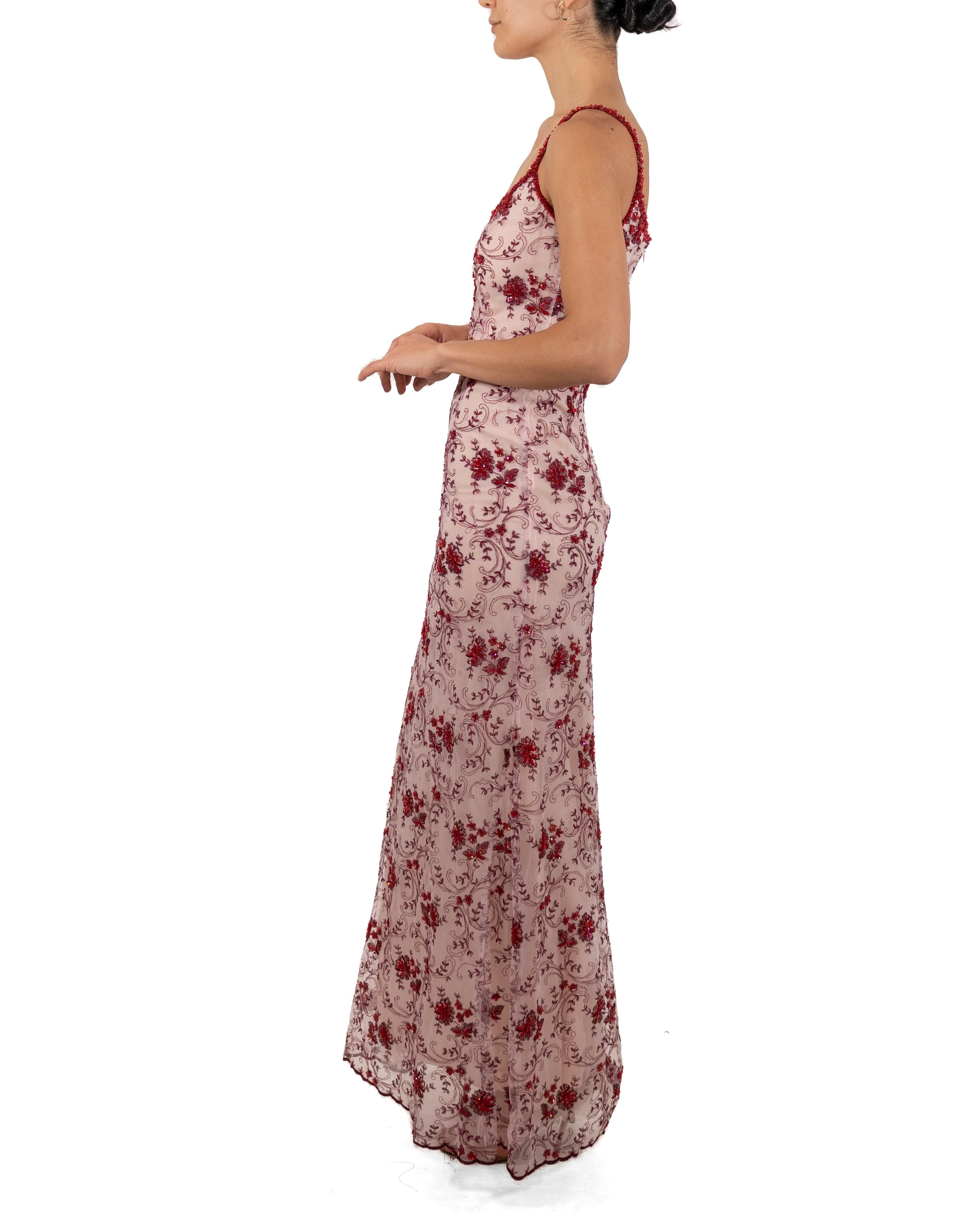 This gown retains no label, however the amount of hand-finishing points to Haute Couture or custom made quality, fully lined in silk. 1990S Red & White Beaded Net Gown 