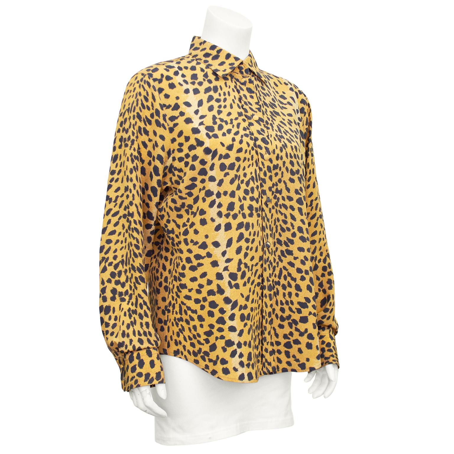 Rena Lange all over leopard print silk shirt from the 1990s. Classic shape with fabric covered buttons and bishop sleeves. Leopard is a neutral and essential part of any wardrobe. Excellent vintage condition. Fits like a US size 6. Made in Germany.