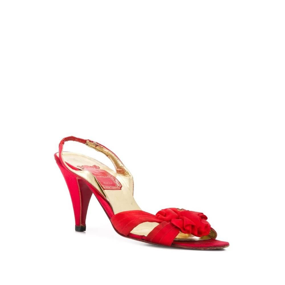 Rene Caovilla red pumps with decorative red satin ribbon and open toe, strap design, elastic strap on the back, medium high stiletto heel, insole with logo.

Years: 90s

Made in Italy

Size: 37,5 EU

Heel: 8 cm
